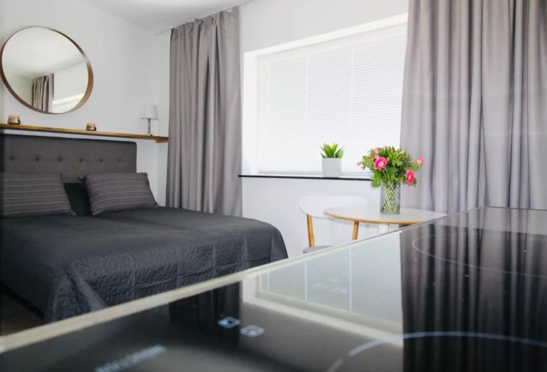 Bed in Easy Livin' Apartment Hotel