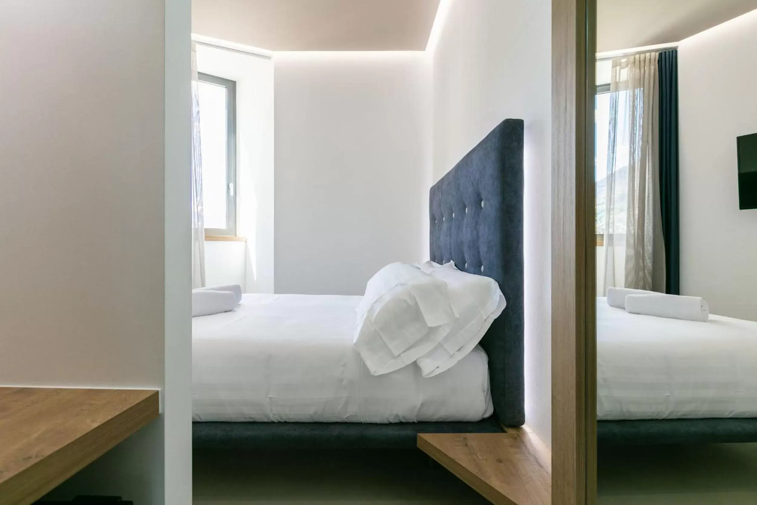 Bed in DOMUS CAVOUR Rooms&Suites