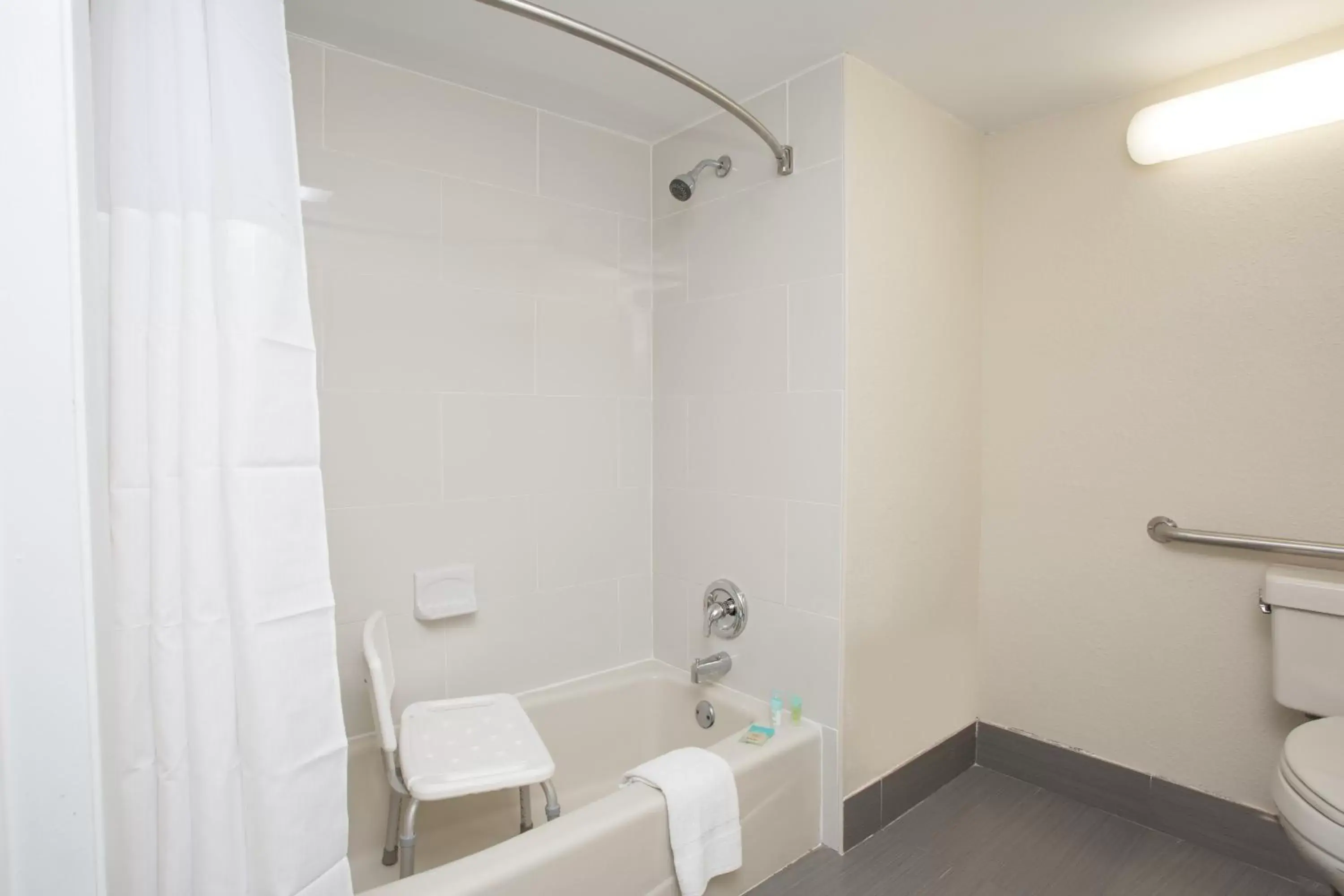Bathroom in Days Inn & Suites by Wyndham Orlando Airport