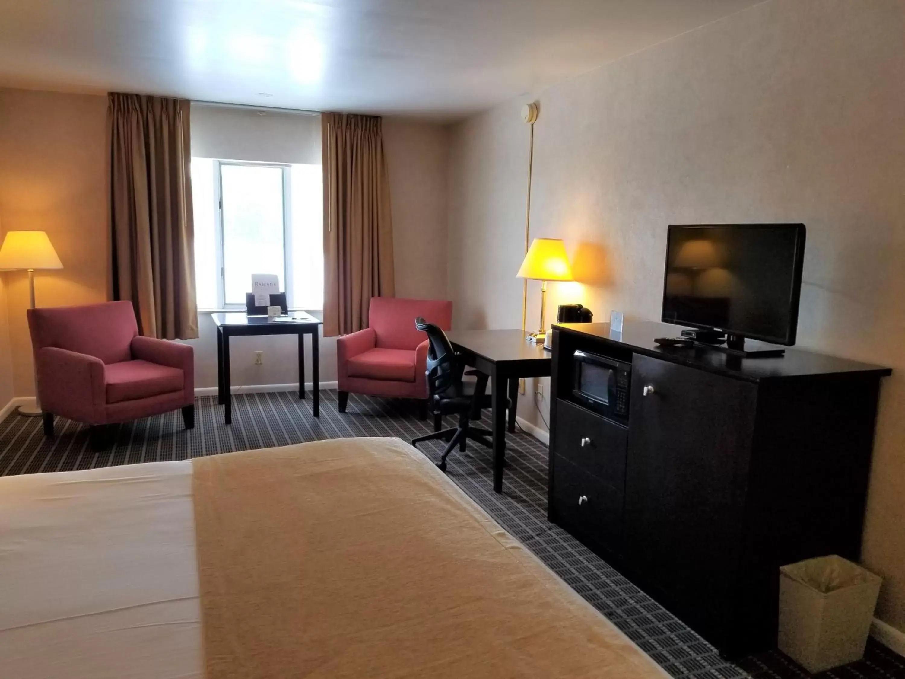 Photo of the whole room, TV/Entertainment Center in Ramada by Wyndham Washington
