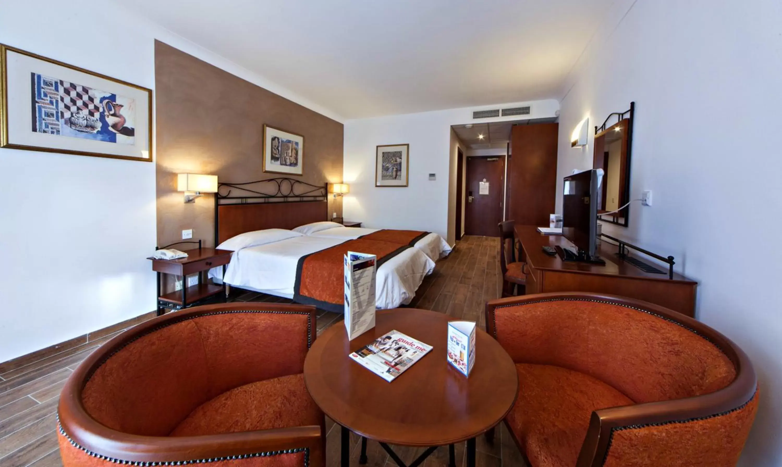 Bed in Golden Tulip Vivaldi Hotel