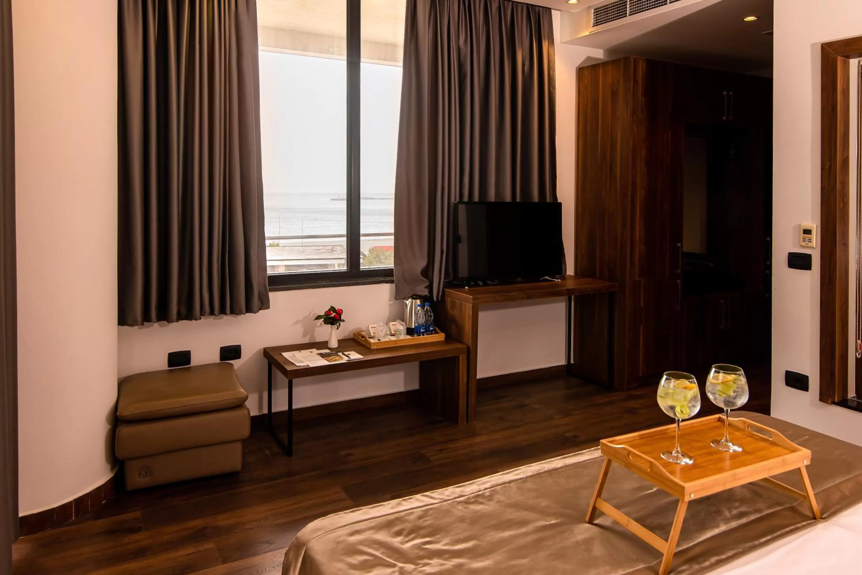 Seating area, Bed in Deluxe & Executive SPA by Rafaelo