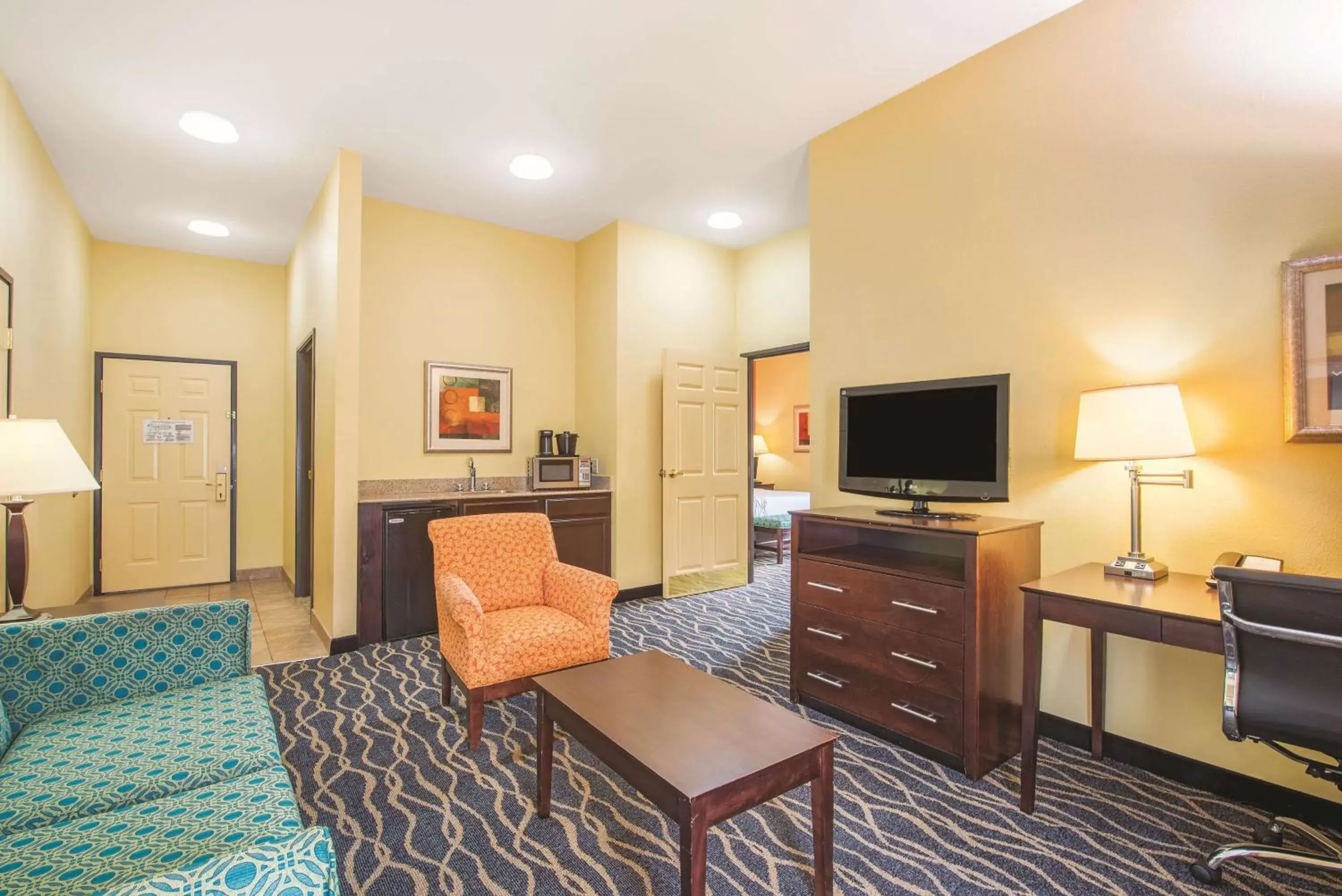 Photo of the whole room, TV/Entertainment Center in La Quinta by Wyndham Tulsa Airport / Expo Square