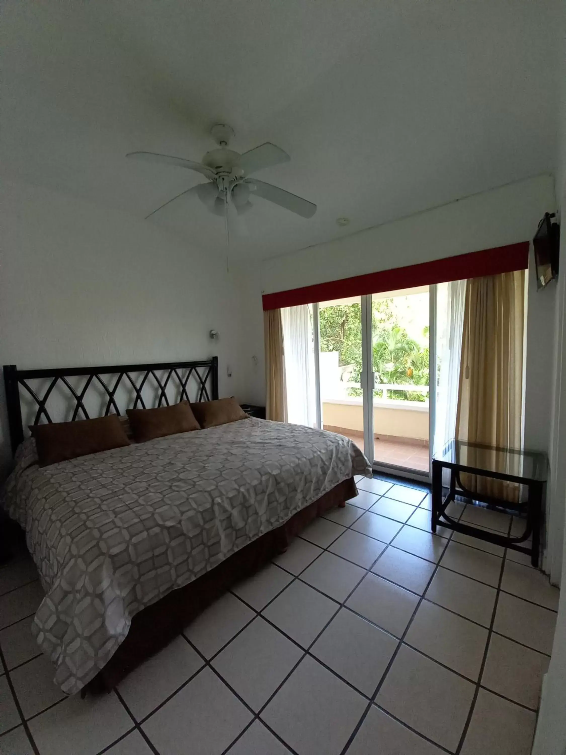 Photo of the whole room, Bed in Villas del Palmar Manzanillo with Beach Club