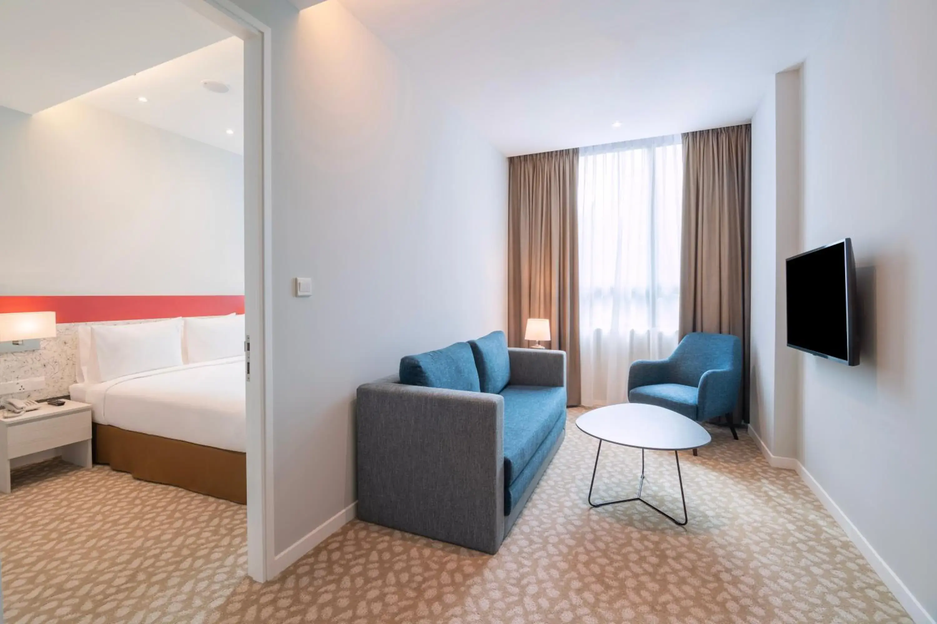 Living room, Bed in Holiday Inn Express & Suites Johor Bahru by IHG Living room, Bed in Holiday Inn Express & Suites Johor Bahru by IHG