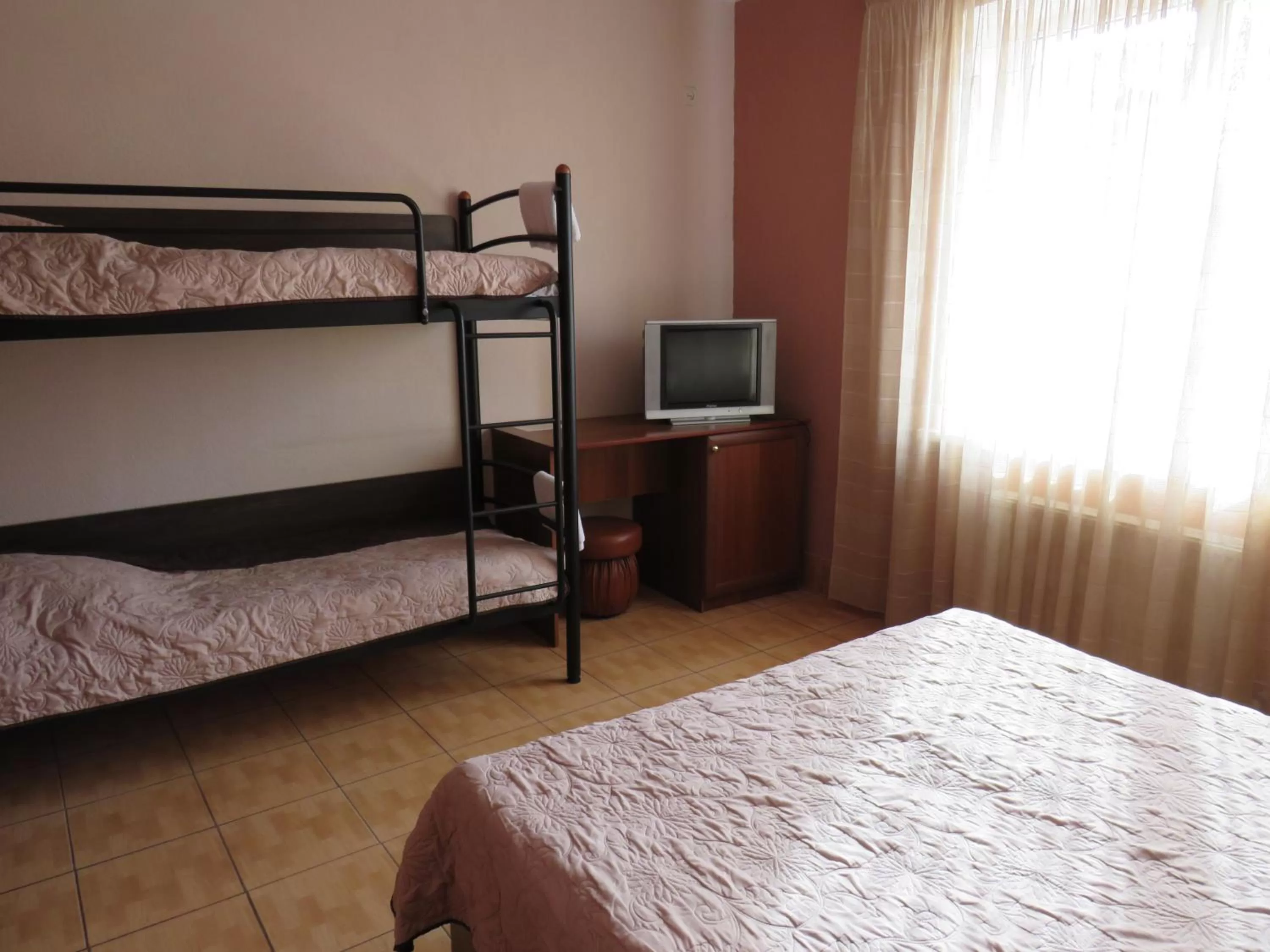 Bed in Monte-Kristo Hotel