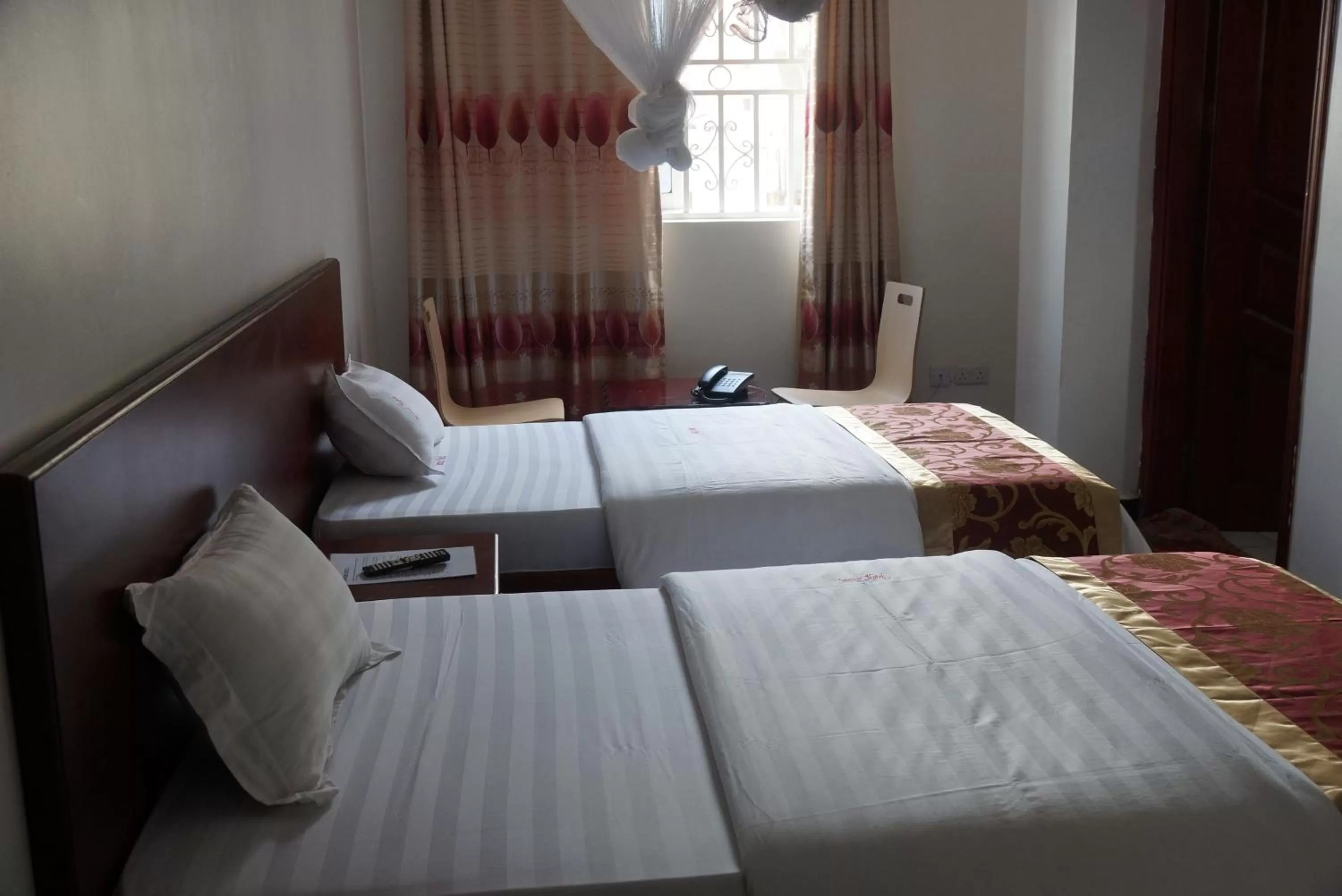 Bed in Sunrise Hotel Kampala