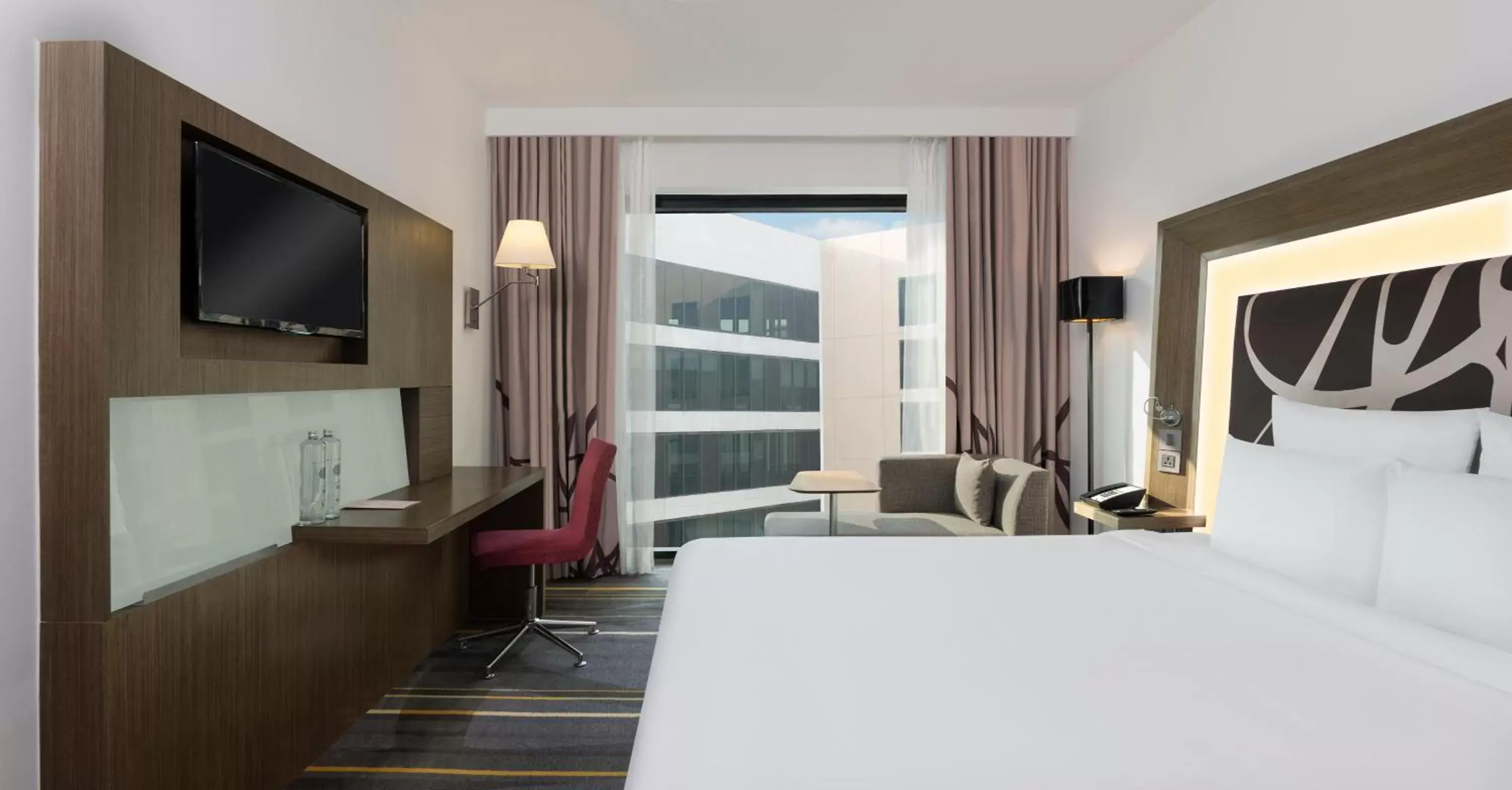 Bed, TV/Entertainment Center in Novotel New Delhi Aerocity- International Airport