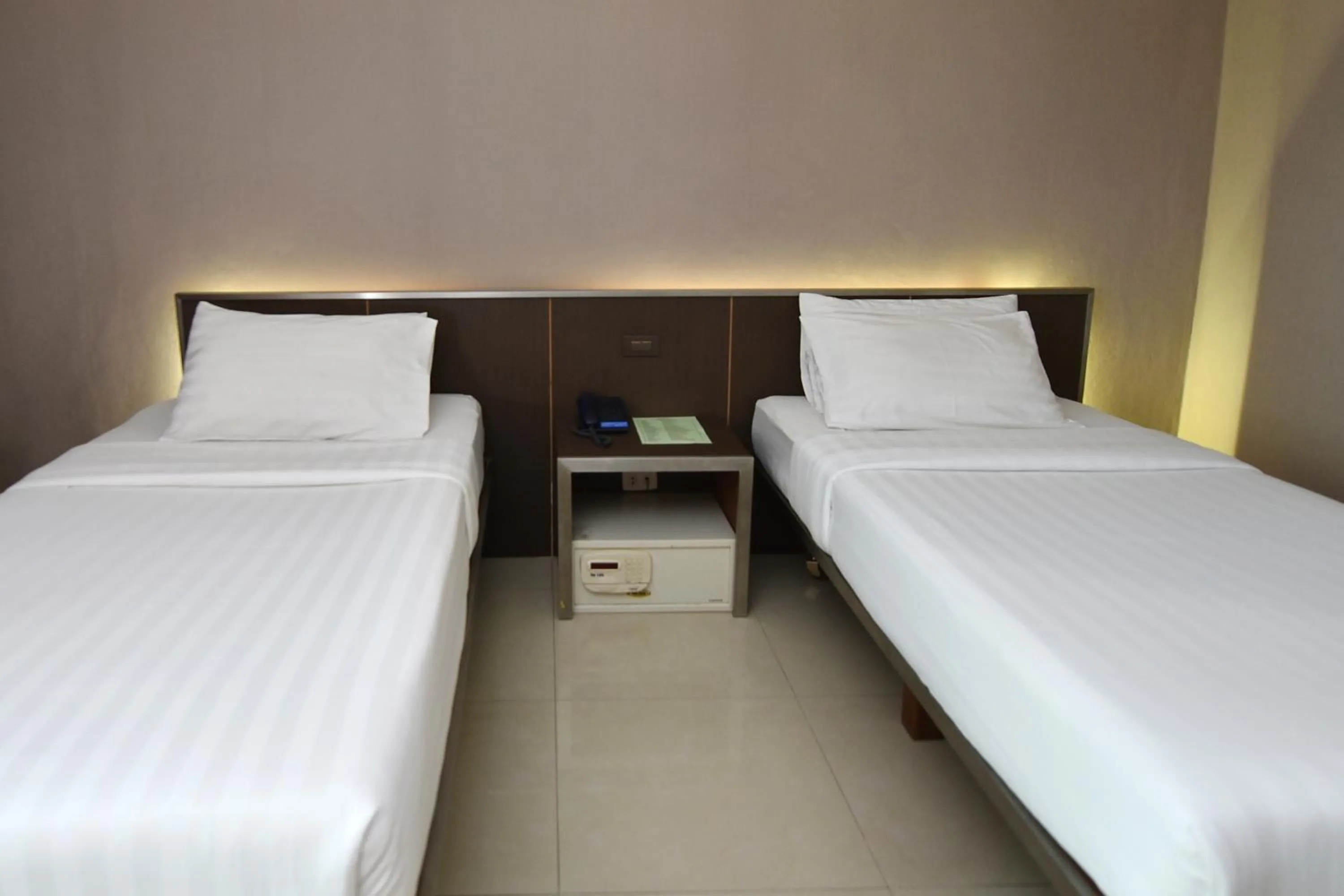 Bed in Bangkok City Suite