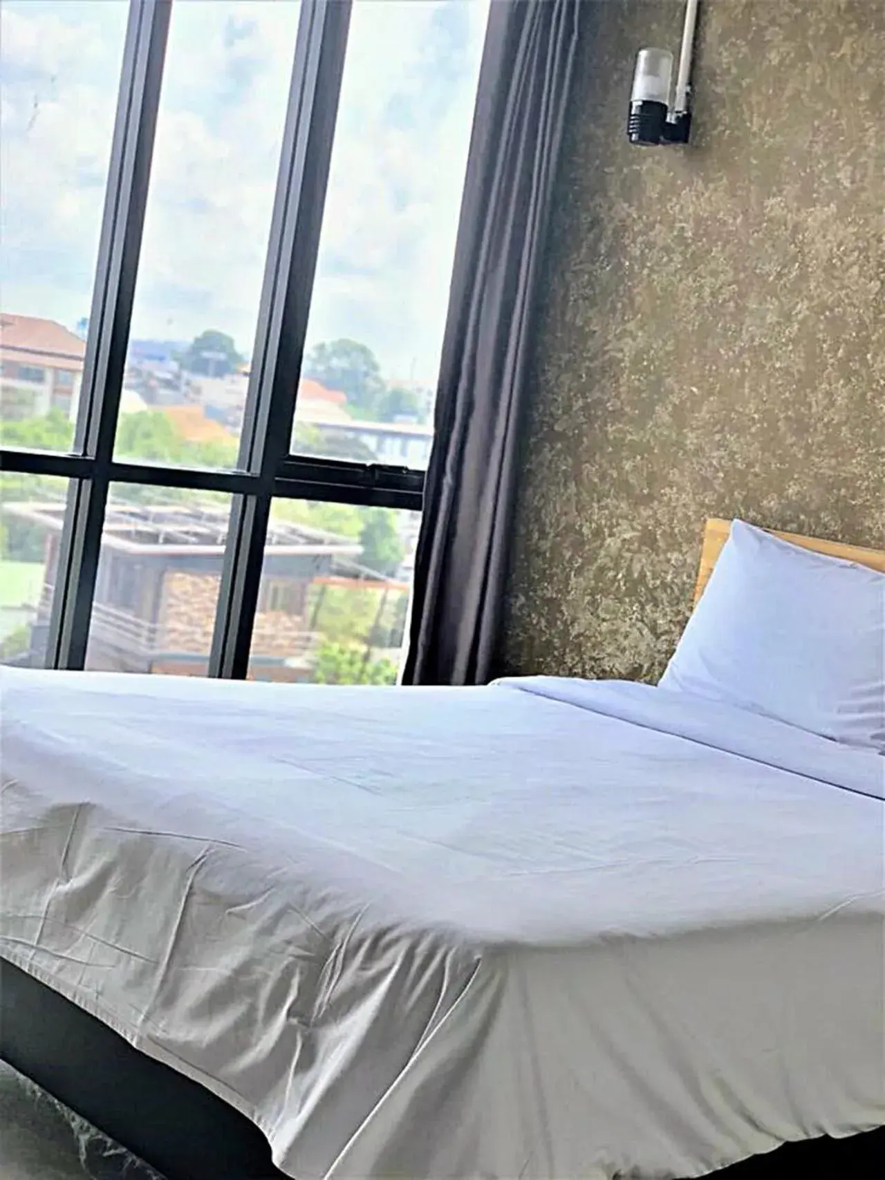 View (from property/room), Bed in Izen Plus Budget Hotel & Residence View (from property/room), Bed in Izen Plus Budget Hotel & Residence