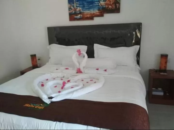 Bed in Madu Tiga Beach and Resort