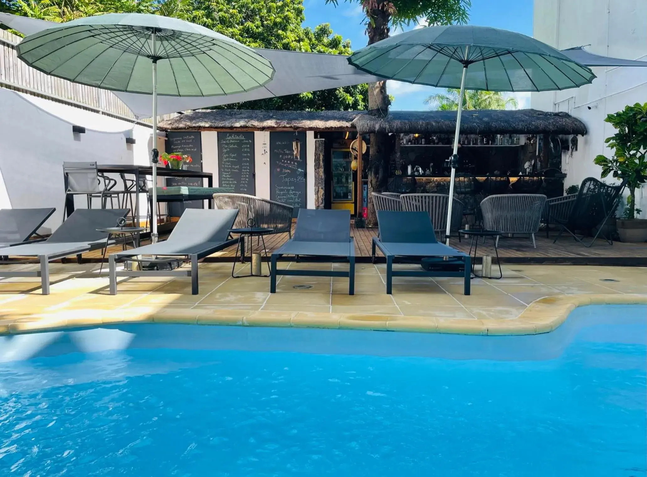 Swimming Pool in Sous Le Badamier Guest House Restaurant Bar