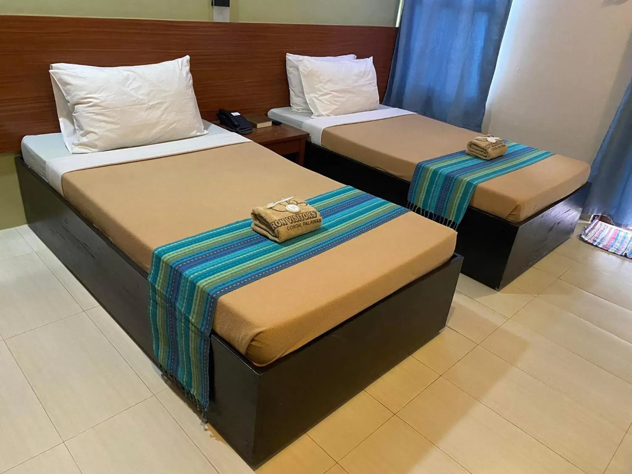 Bed in Coron Visitors Hotel