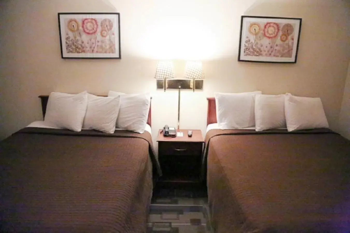 Bed in The Inn and Suites at 34 Fifty