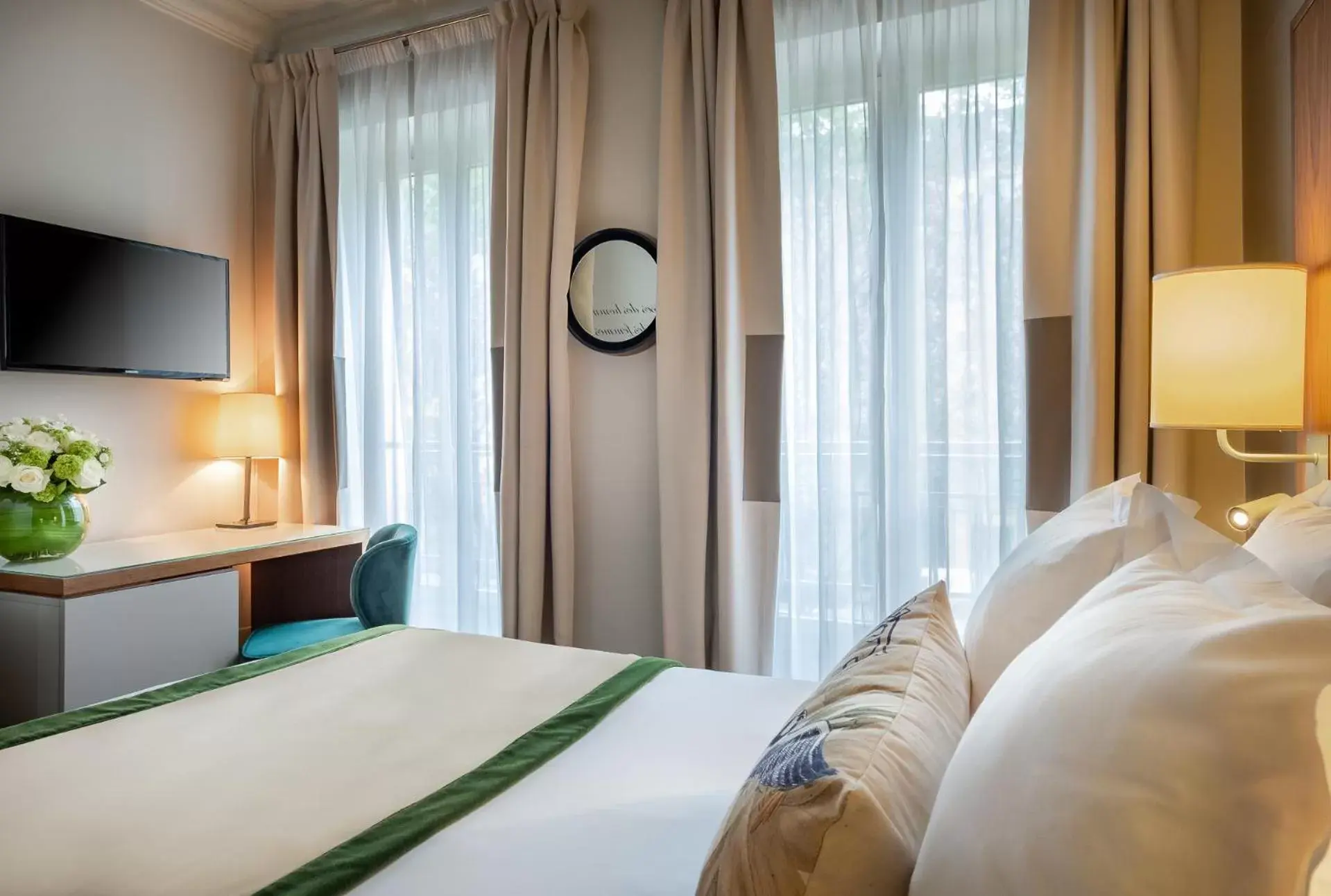 Photo of the whole room, Bed in Hôtel Le Tourville by Inwood Hotels