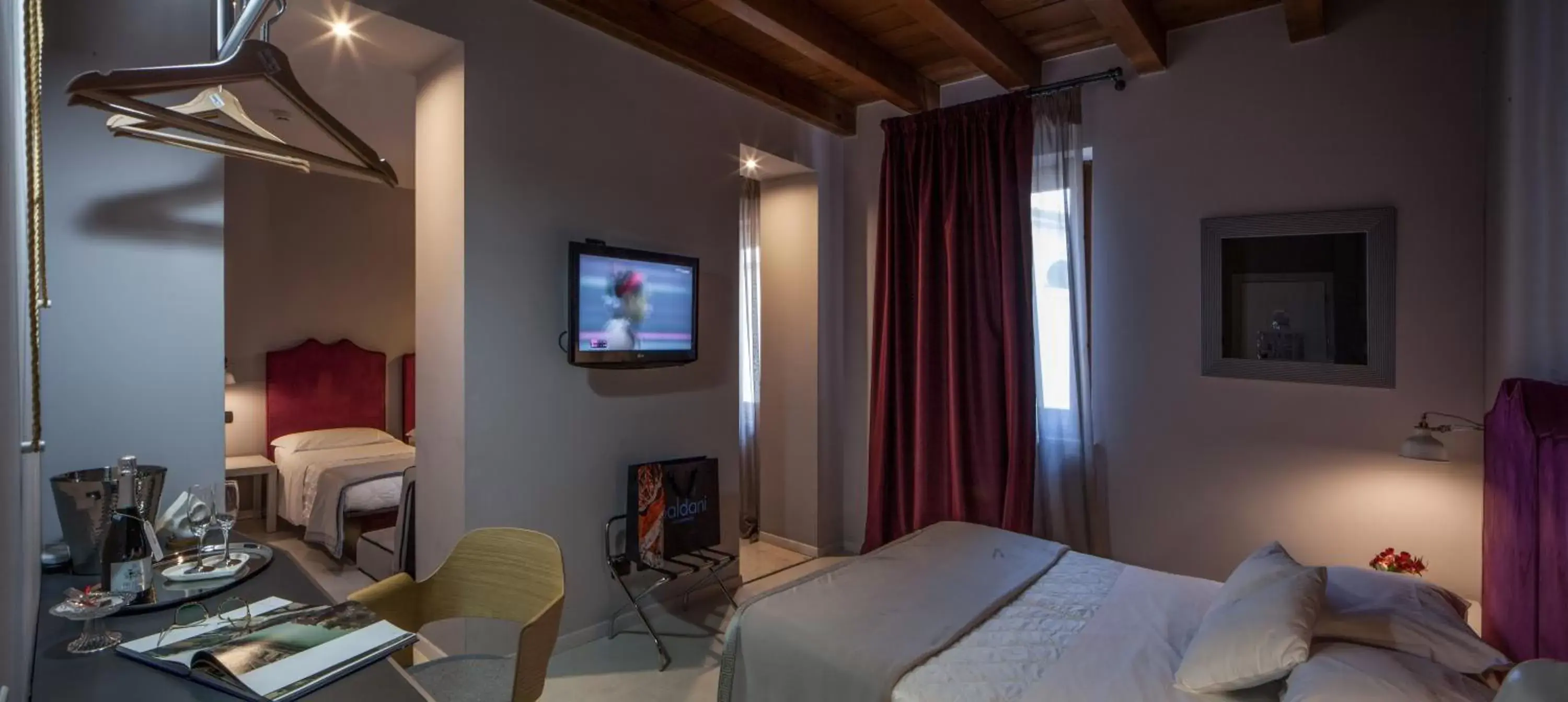 Photo of the whole room, TV/Entertainment Center in Hotel Gattopardo