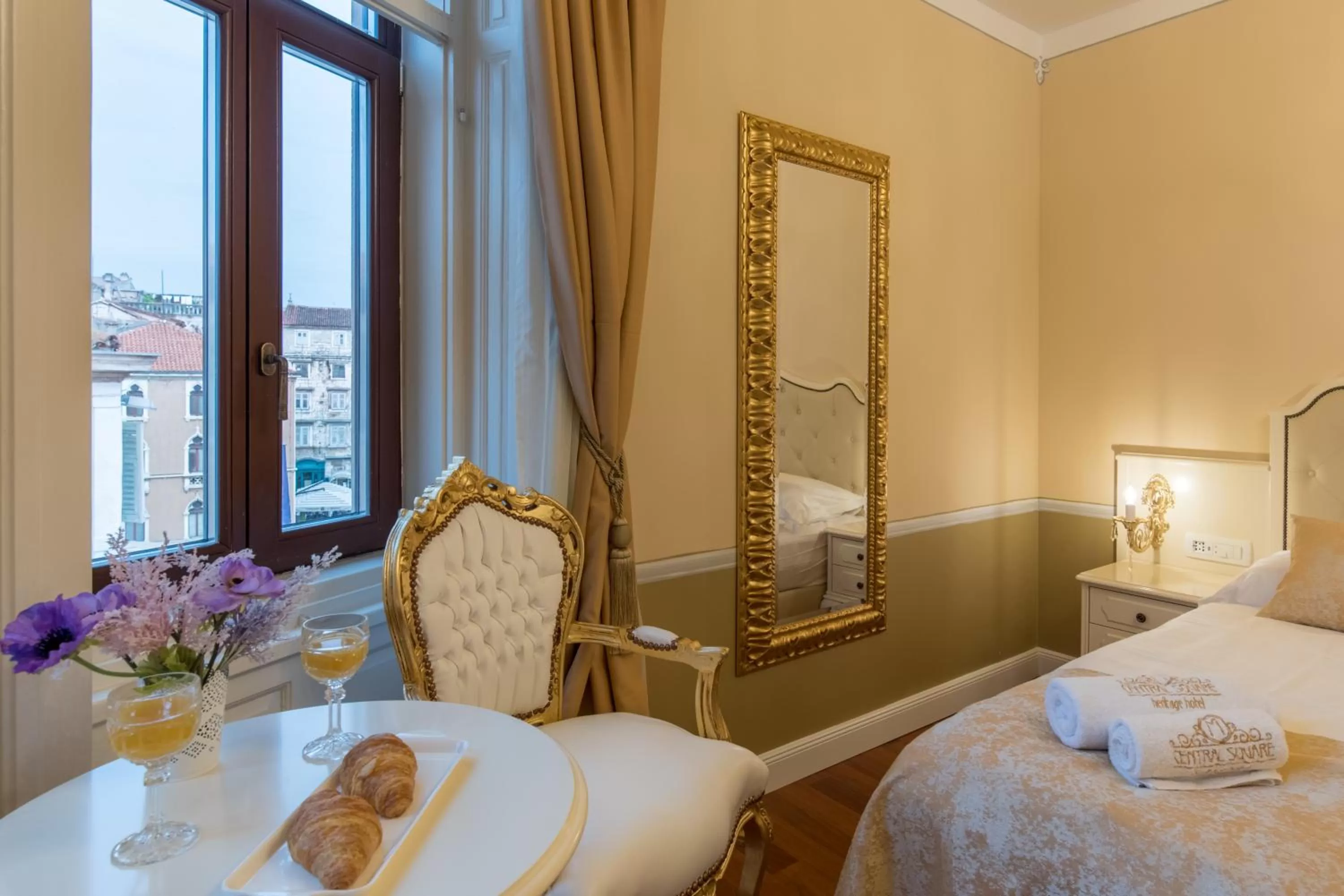 Bed in Central Square Heritage Hotel