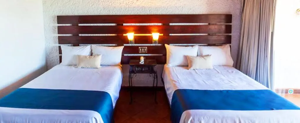 Bed in Las Rocas Resort & Spa