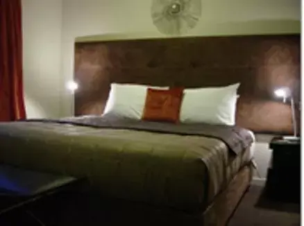Bed in Terra Vive Suites & Apartments
