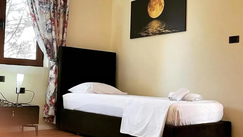 Bed in Hotel Ambasador Garden