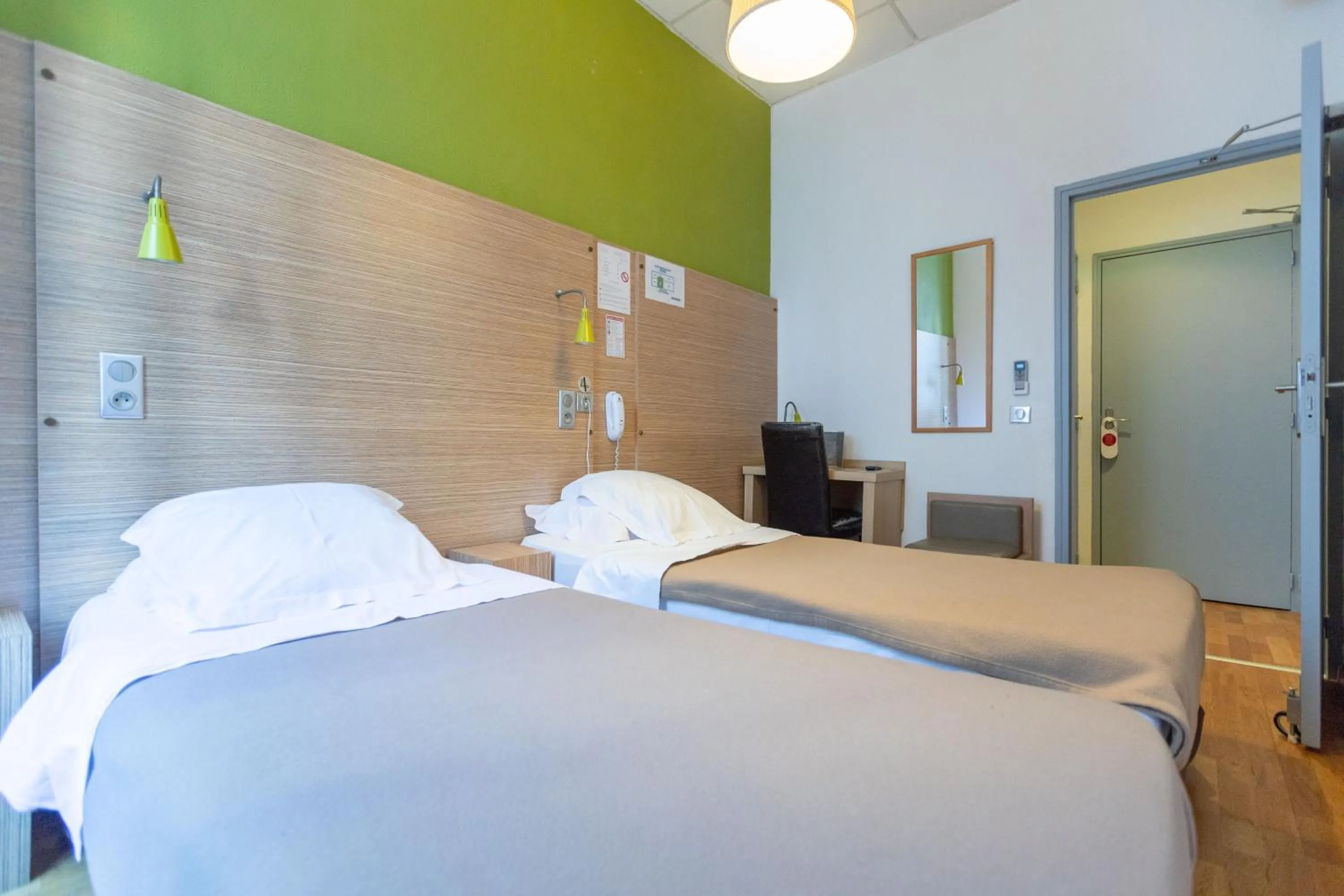 Bed in Hôtel Edmond Rostand