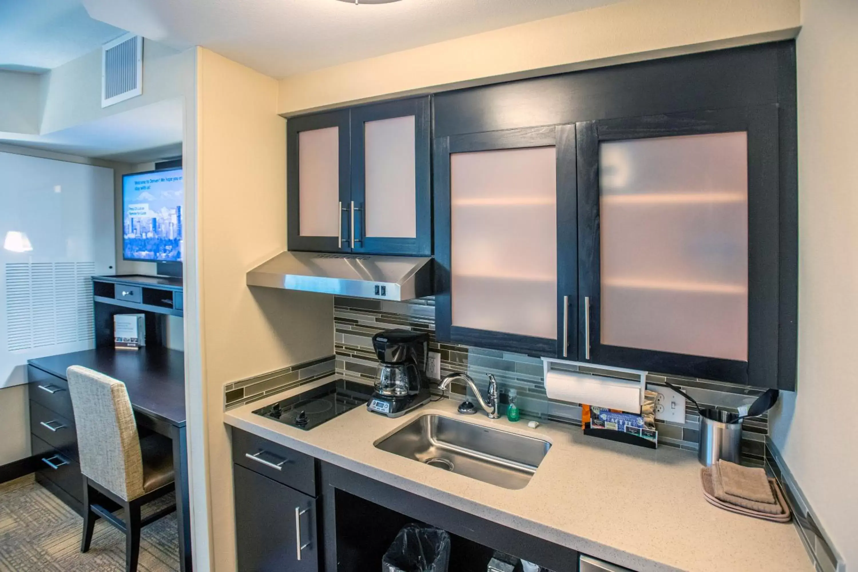Photo of the whole room, Kitchen/Kitchenette in Staybridge Suites Denver Downtown, an IHG Hotel