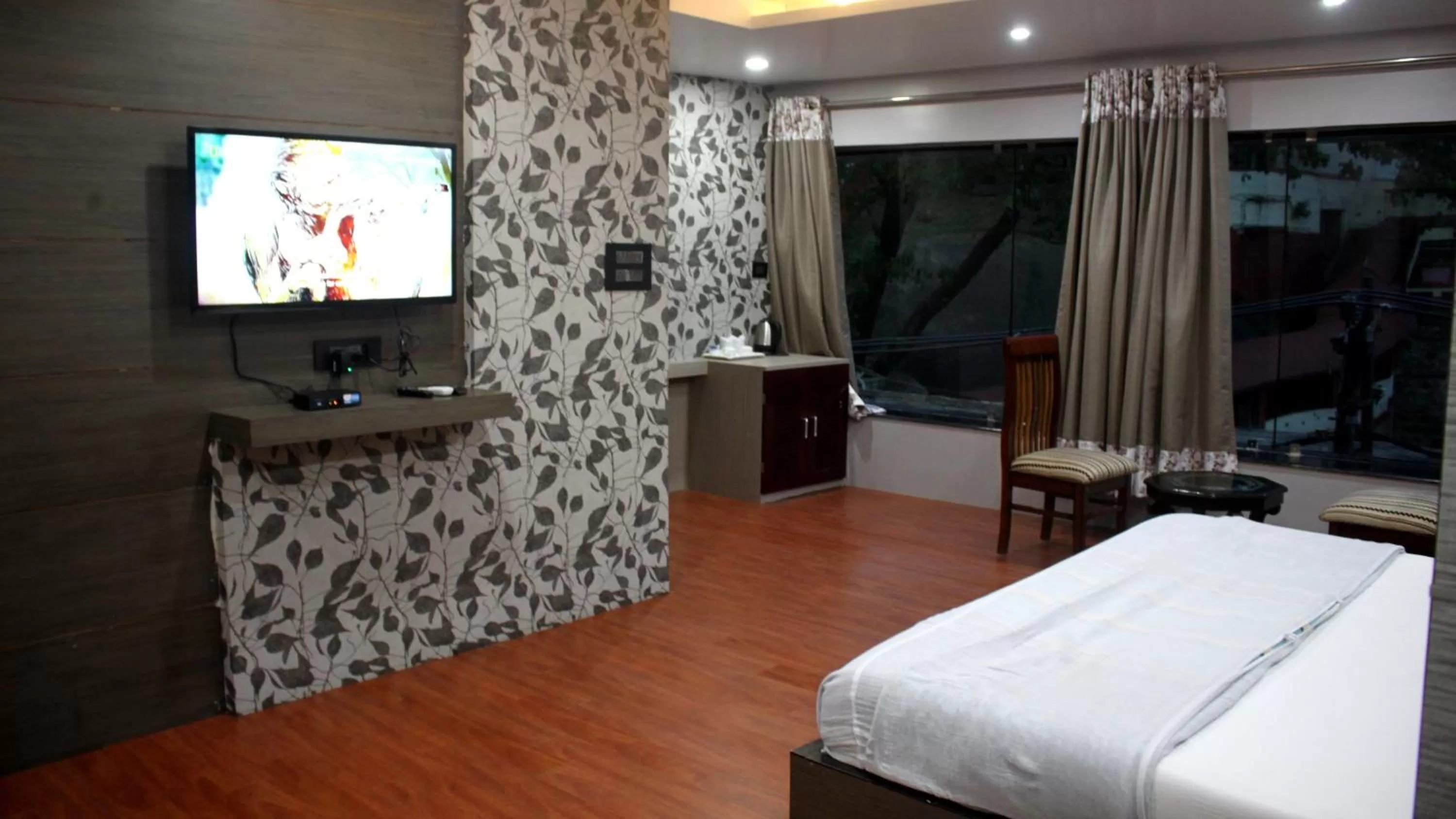 Communal lounge/ TV room, Bed in Hotel Shreemoyee Inn - Kamakhya Temple