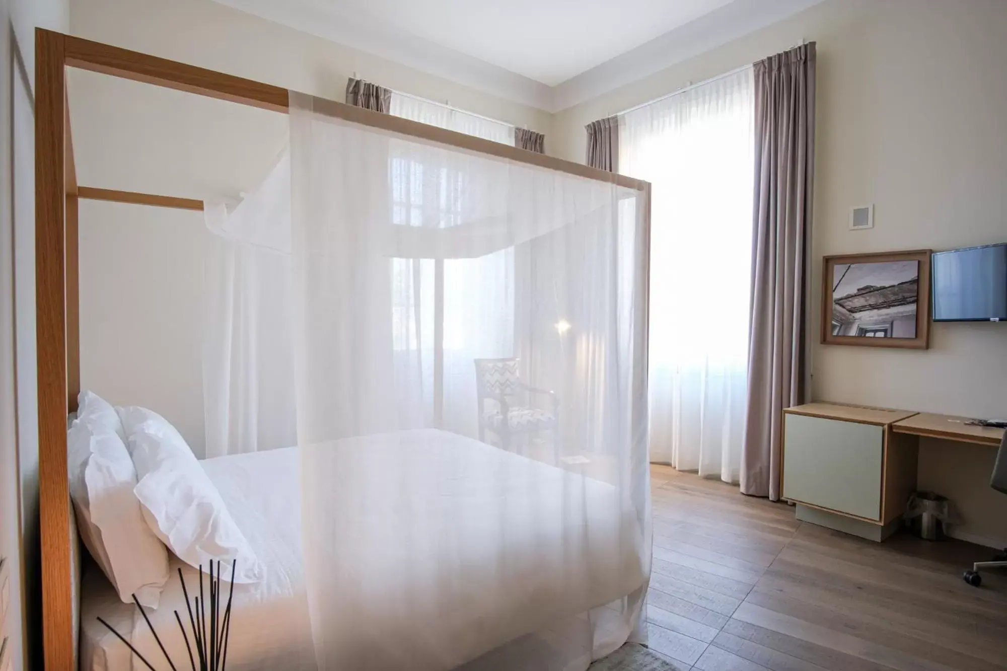 Bed in Dimora de Matera Luxury Suites