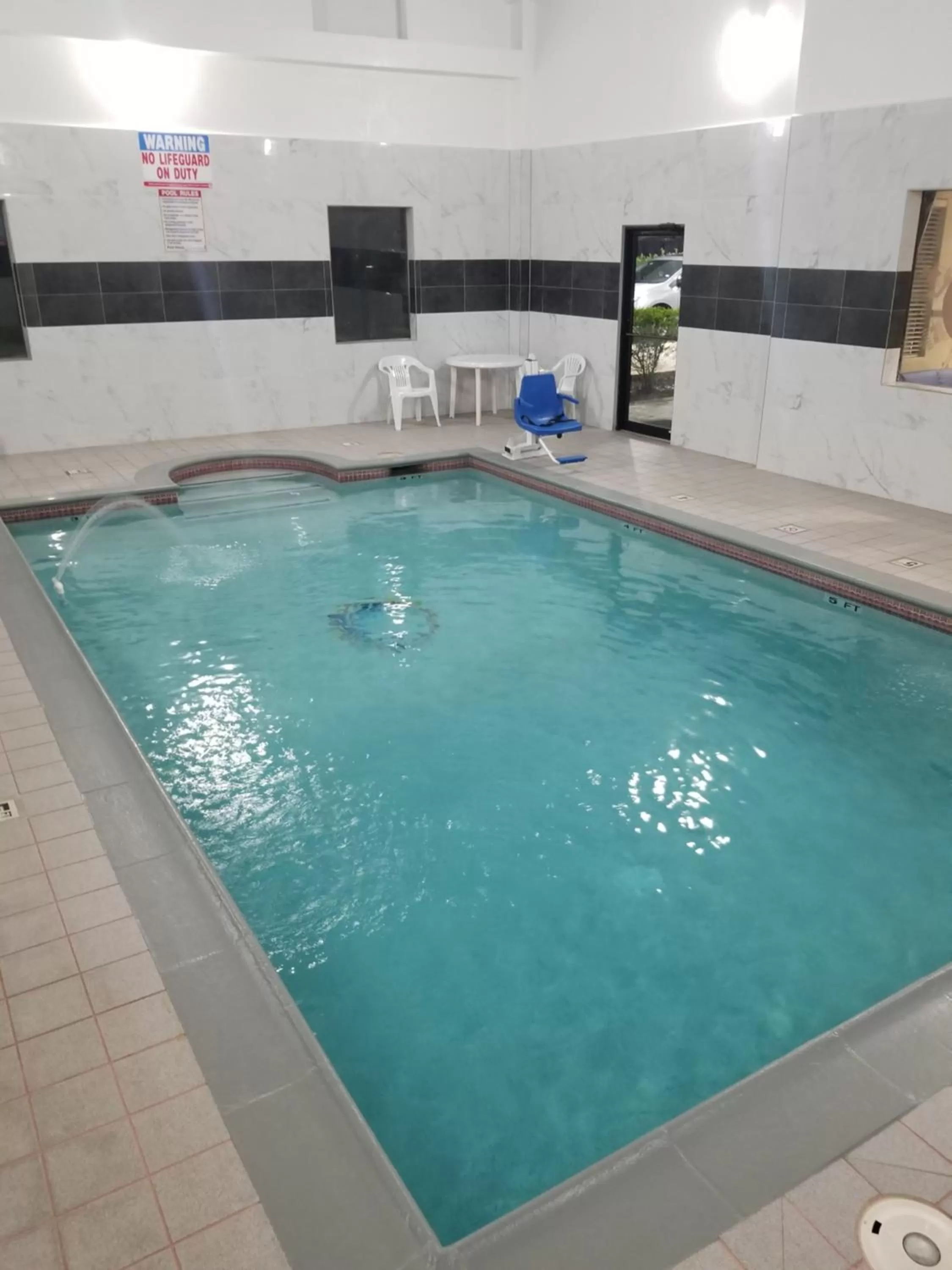 Swimming pool in Days Inn & Suites by Wyndham Webster NASA-ClearLake-Houston