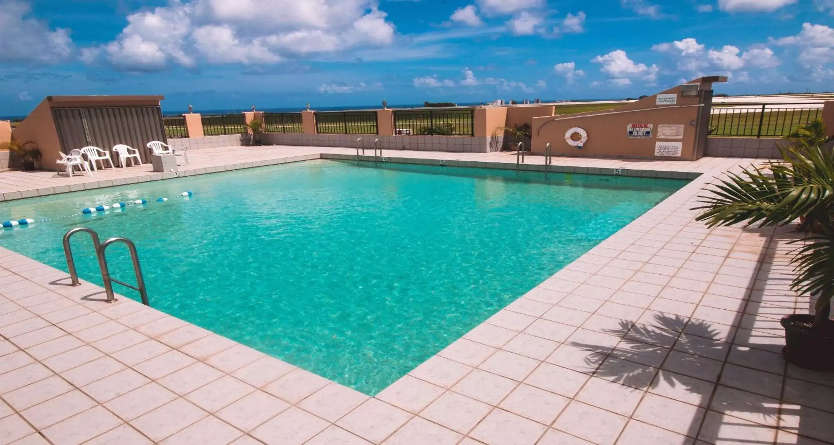 On site, Swimming Pool in SureStay Hotel by Best Western Guam Palmridge