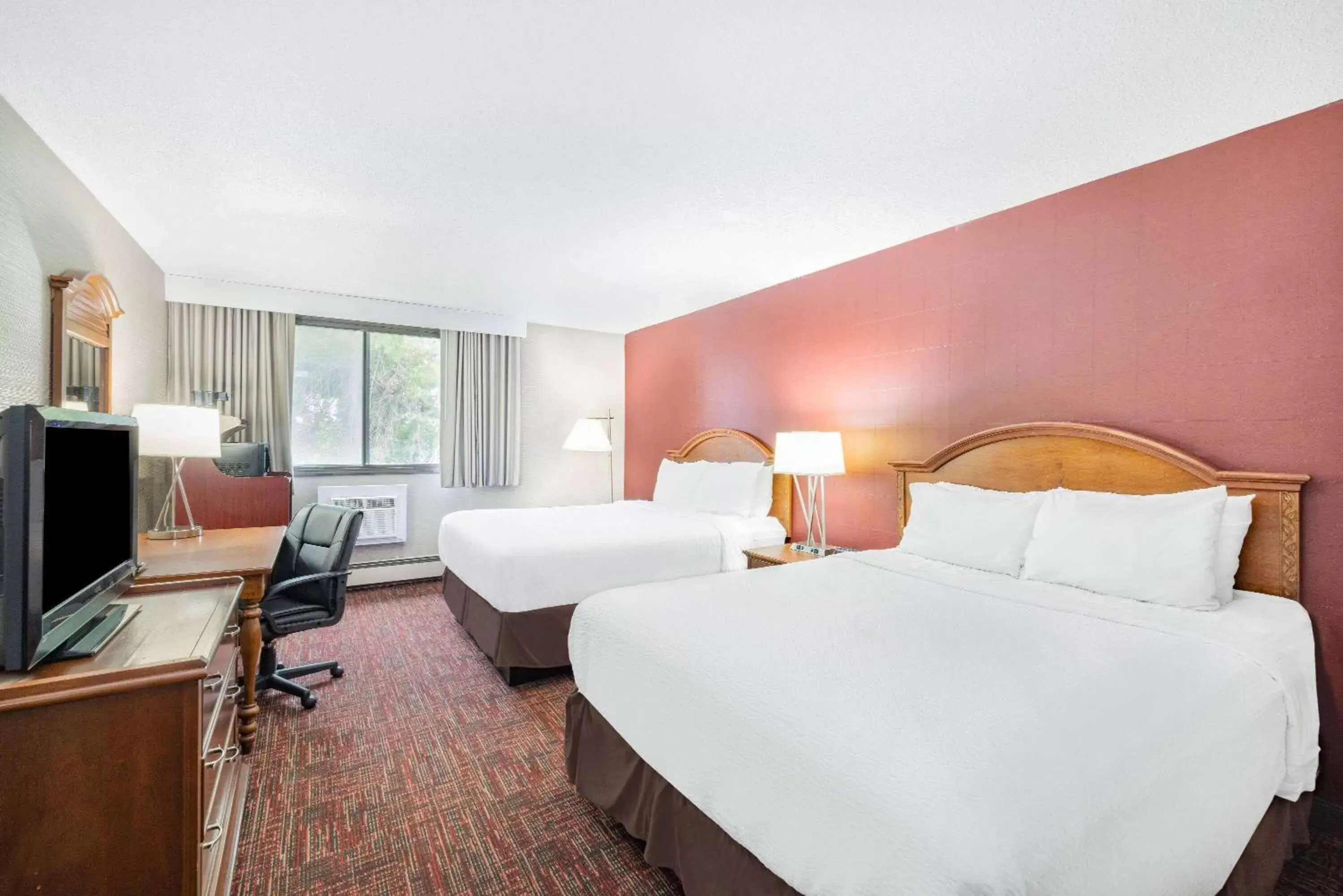 Bed in Ramada by Wyndham Grand Forks