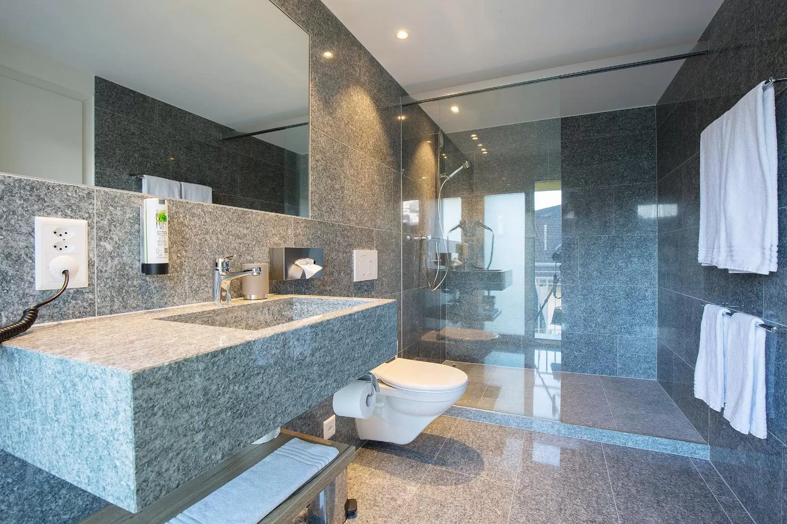 Bathroom in Hotel Vaduzerhof by b-smart