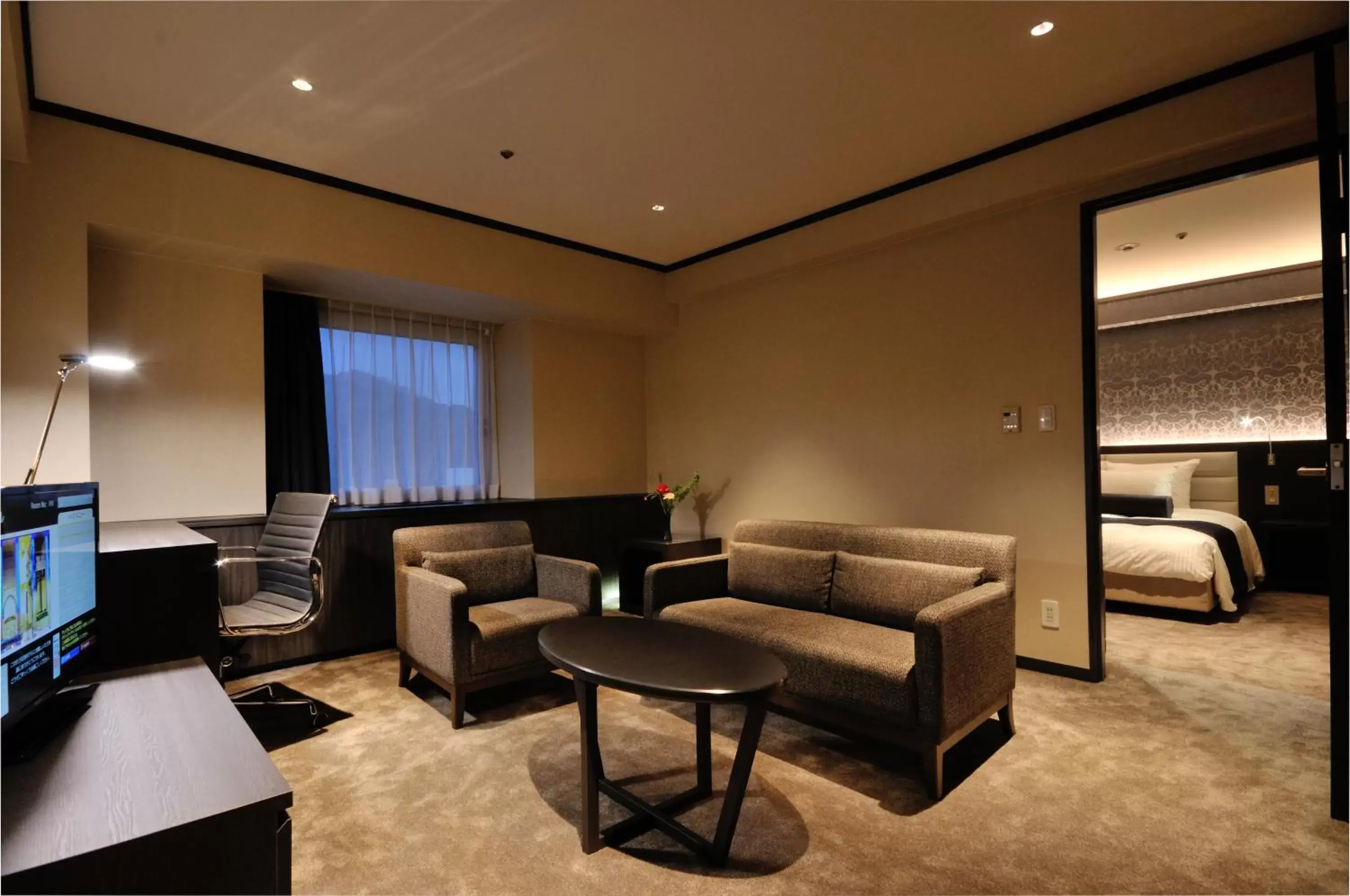 Photo of the whole room, Seating Area in ANA Crowne Plaza Matsuyama, an IHG Hotel
