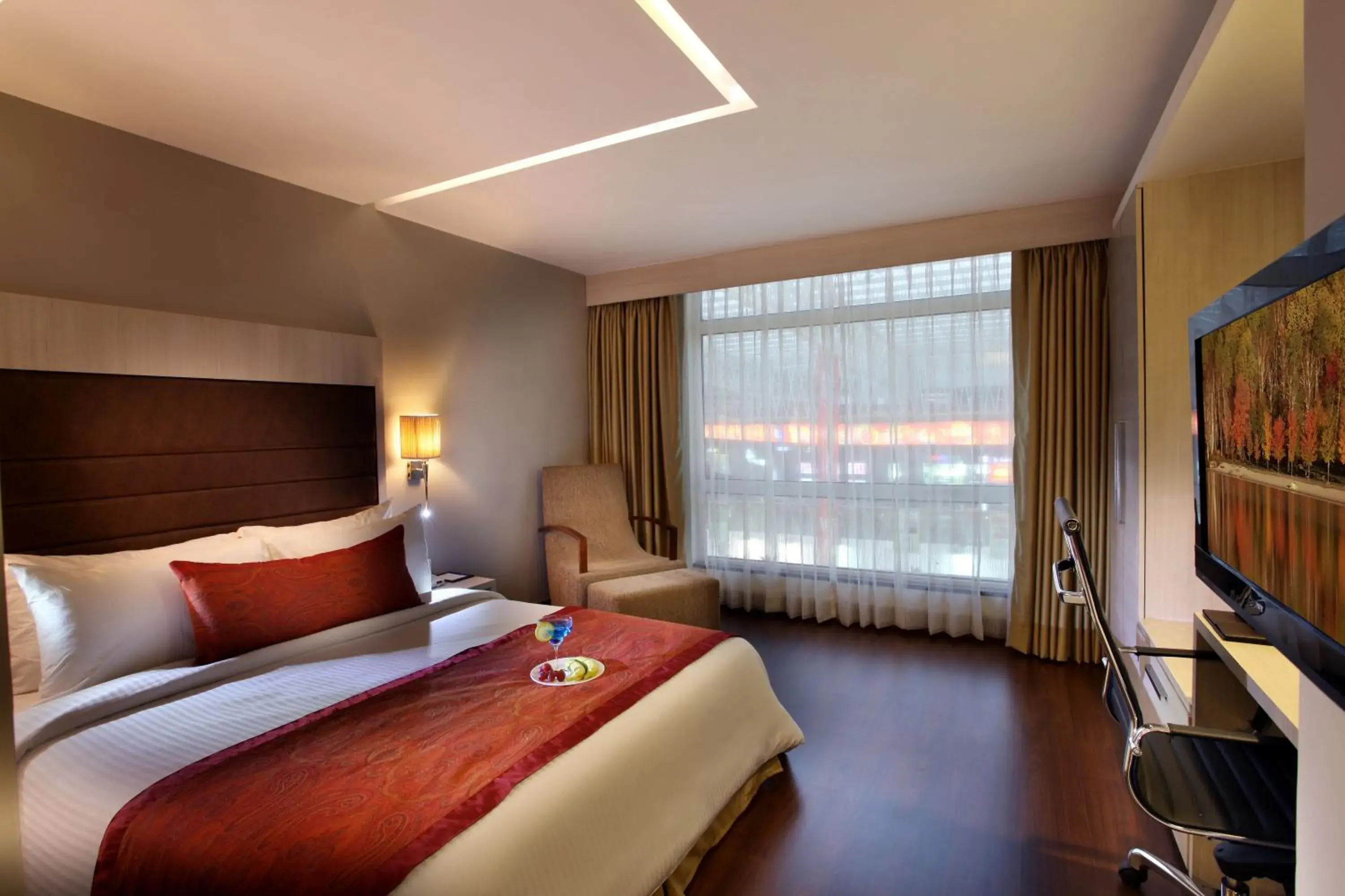 Bed in Mahagun Sarovar Portico Suites Ghaziabad