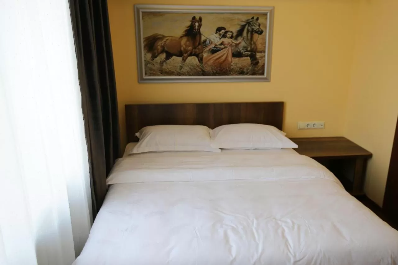 Bed in Altai Business Hotel