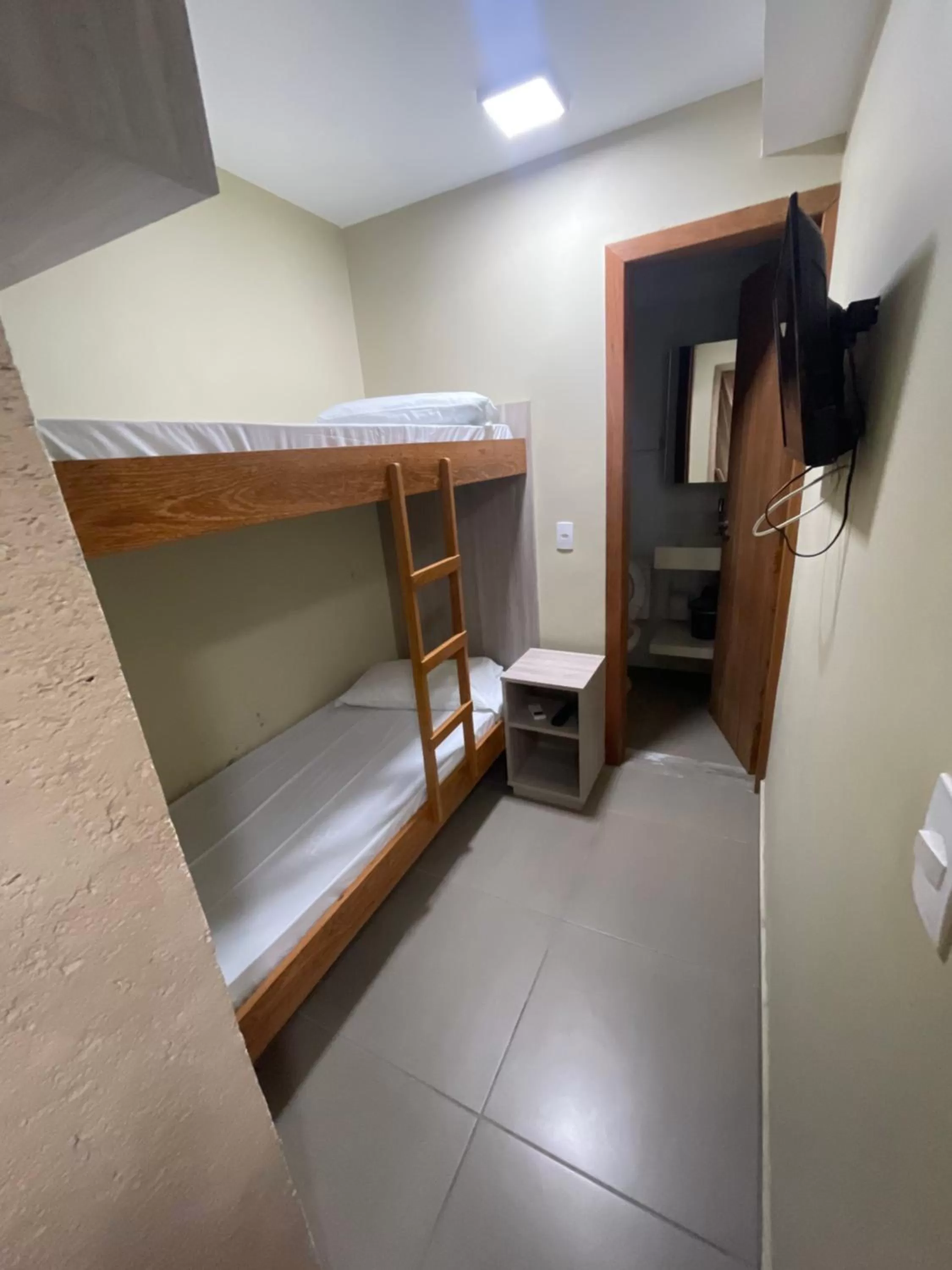 Bed in Pousada Tissiano