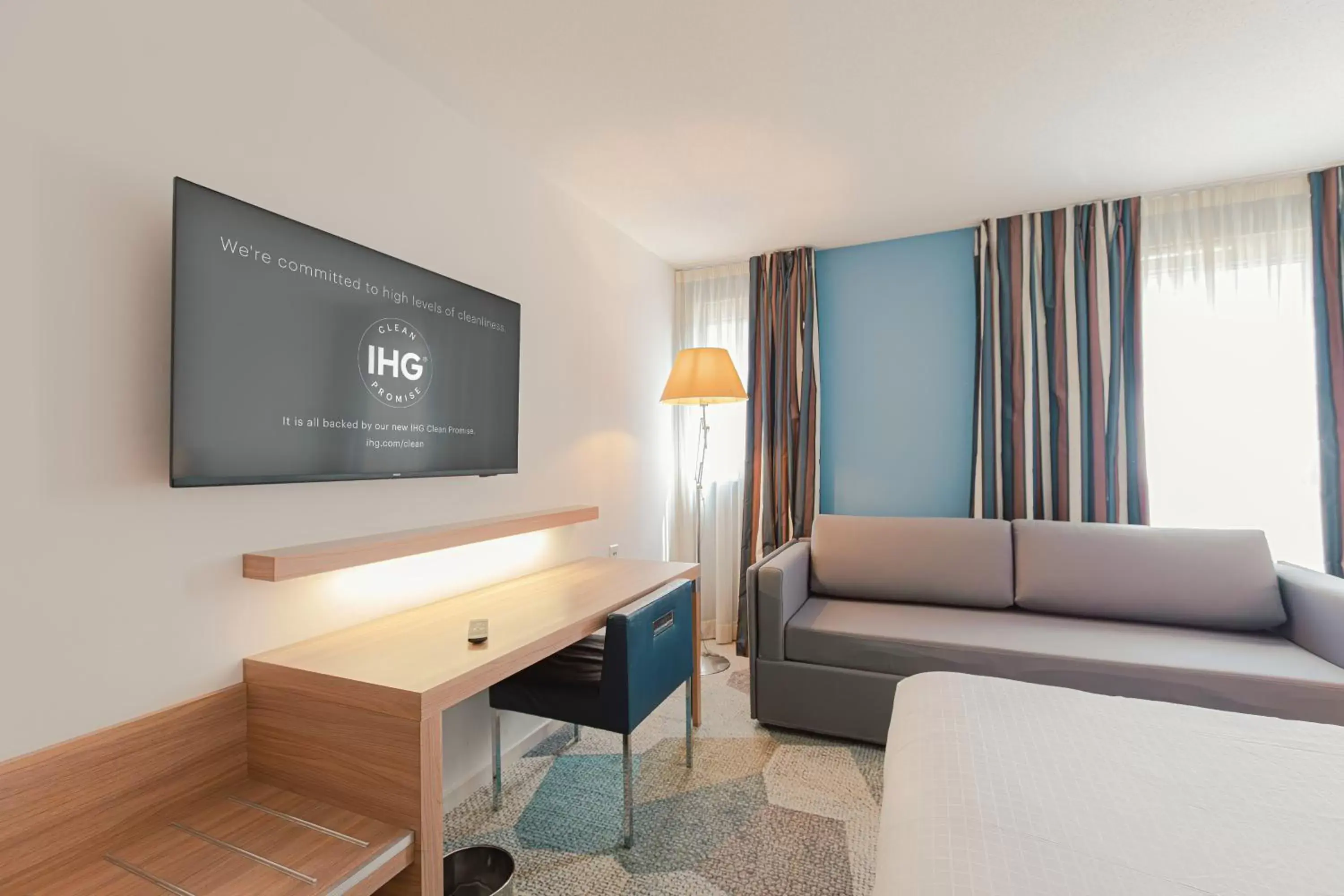 Photo of the whole room, TV/Entertainment Center in Holiday Inn Mulhouse, an IHG Hotel
