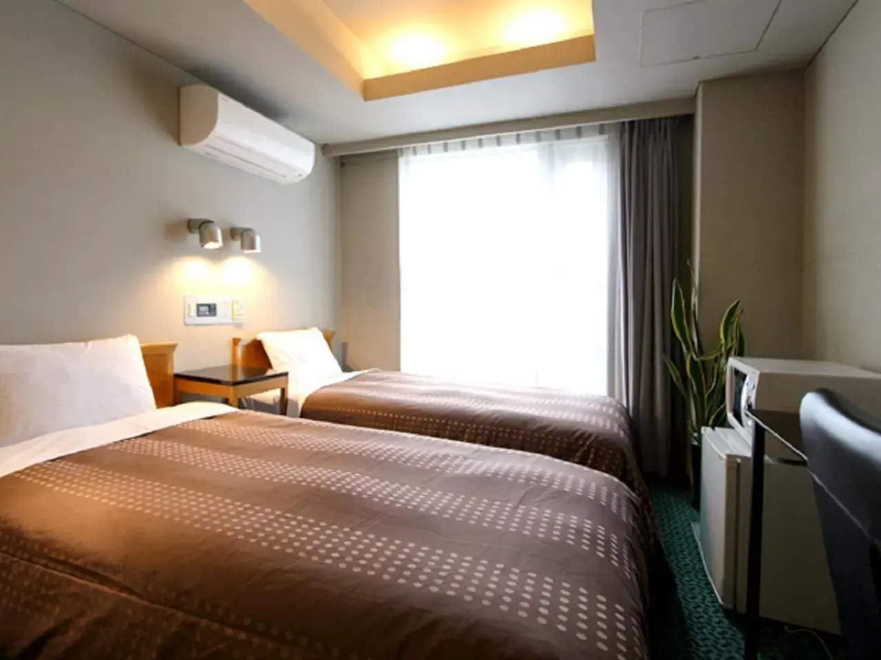 Bed in HOTEL LiVEMAX BUDGET Yumoto