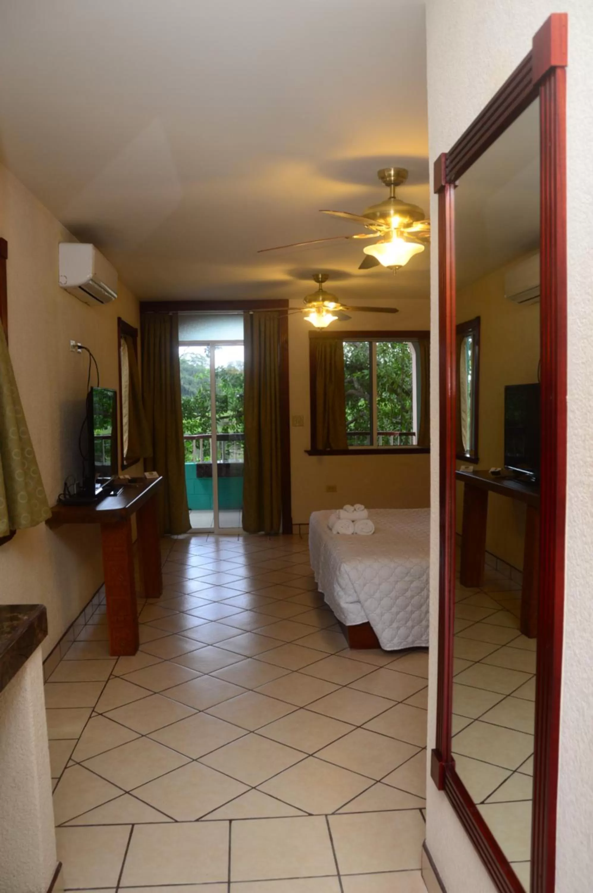 Bed in Lamanai Hotel & Marina