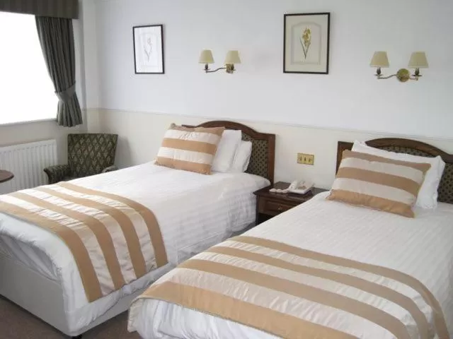 Bed in The Saracens Head Hotel