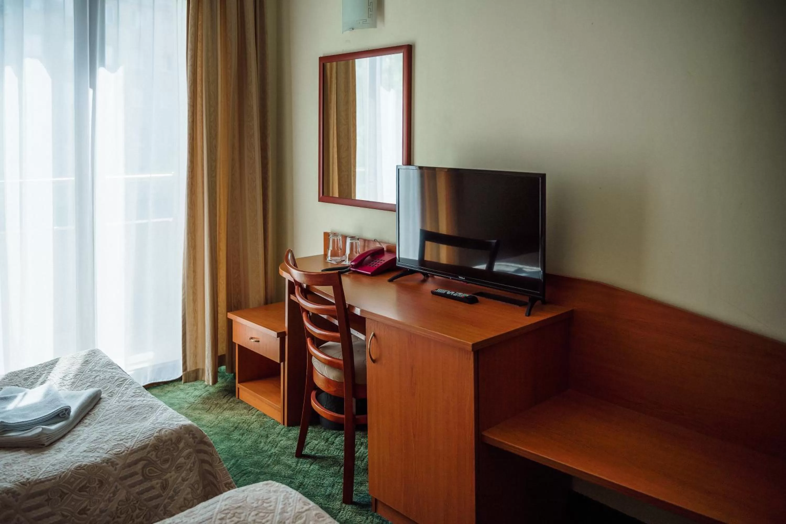 Communal lounge/ TV room, Bed in Dionis Hotel