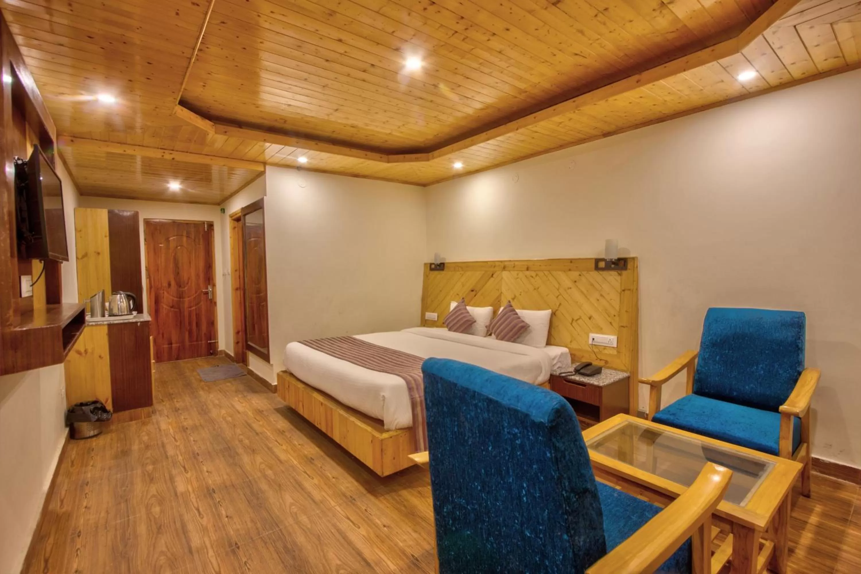 Bed in Snow City's Montana Blues Resort Manali - Heated & Air-Cooled Stay