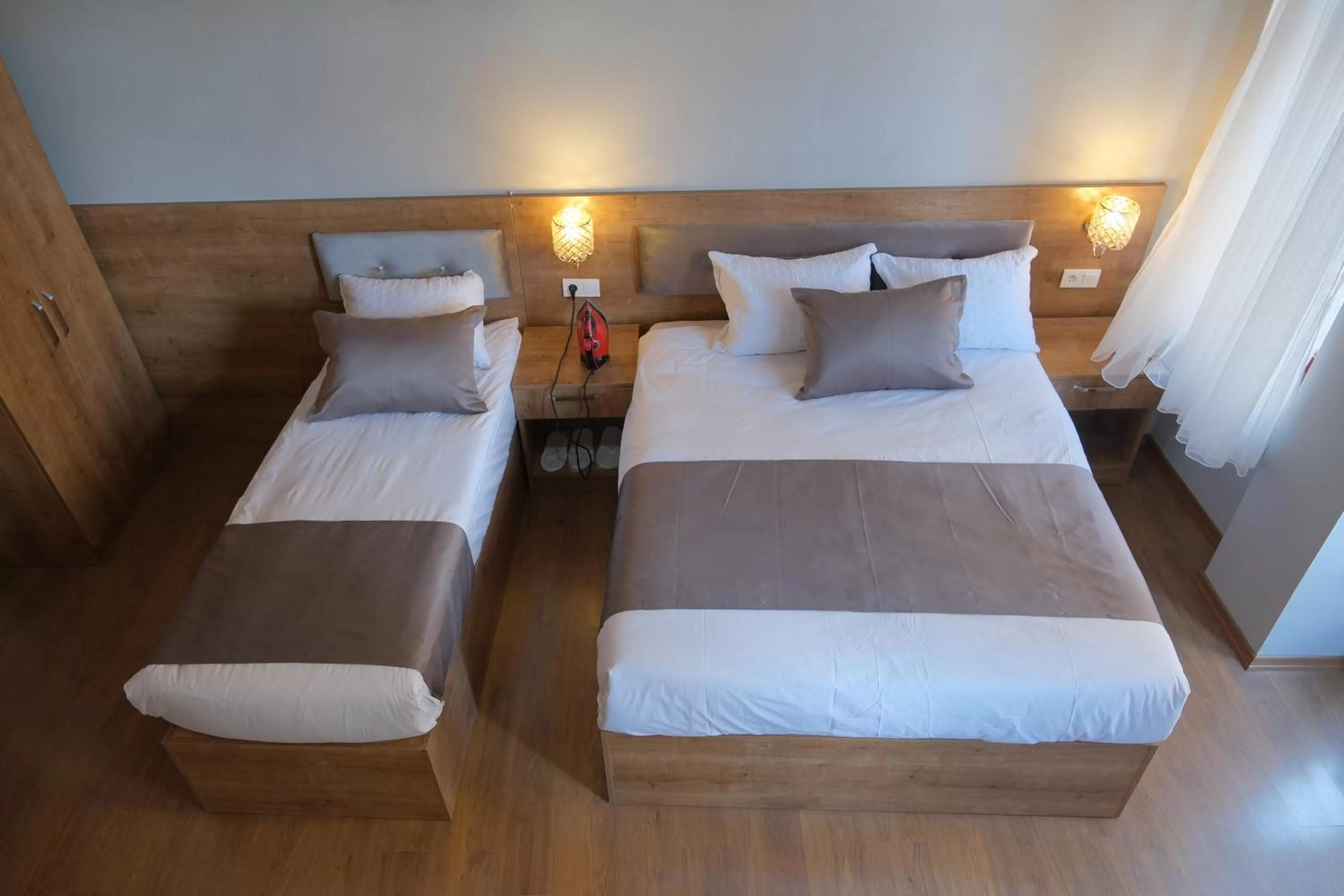 Bed in Adamantides Hotel