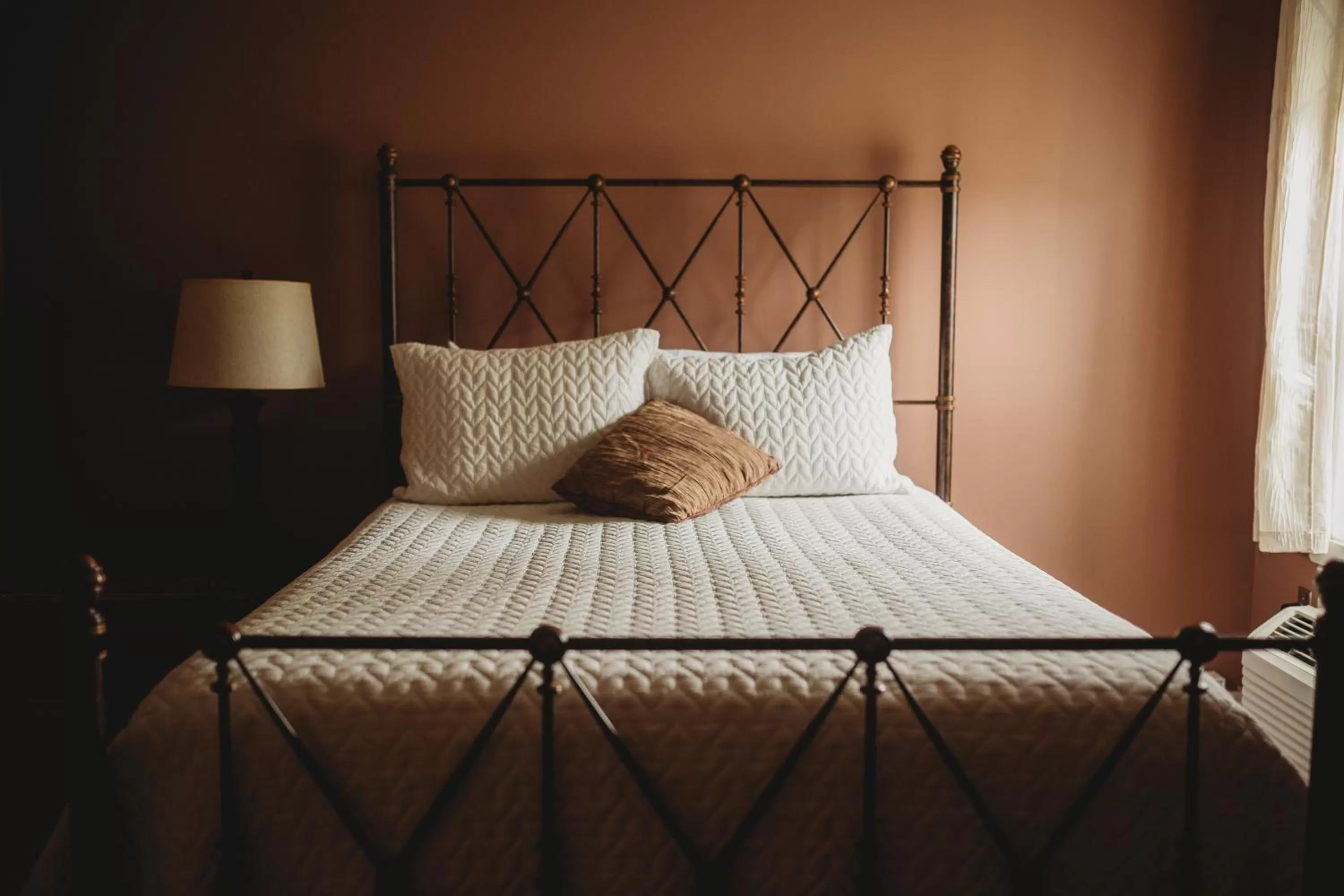 Bedroom, Bed in Carriage House Inn Four and a Half Stars