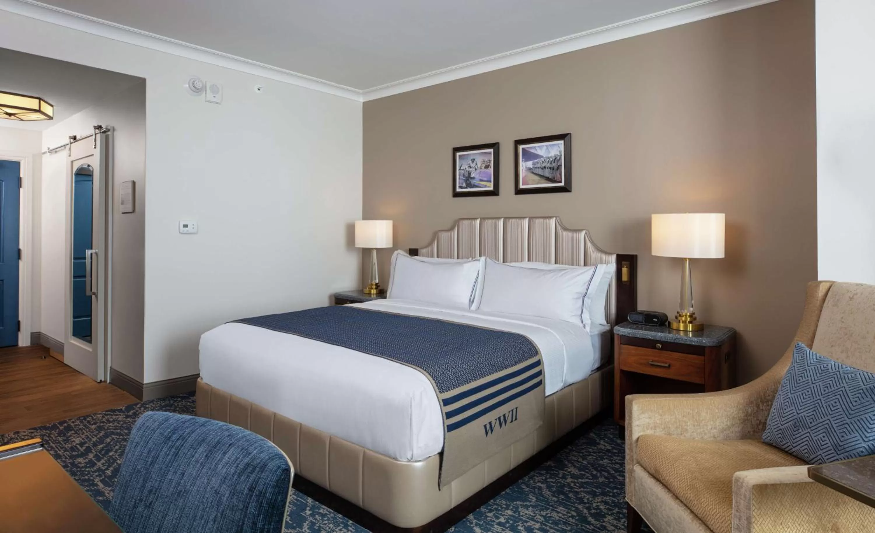 Living room, Bed in The Higgins Hotel New Orleans, Curio Collection by Hilton