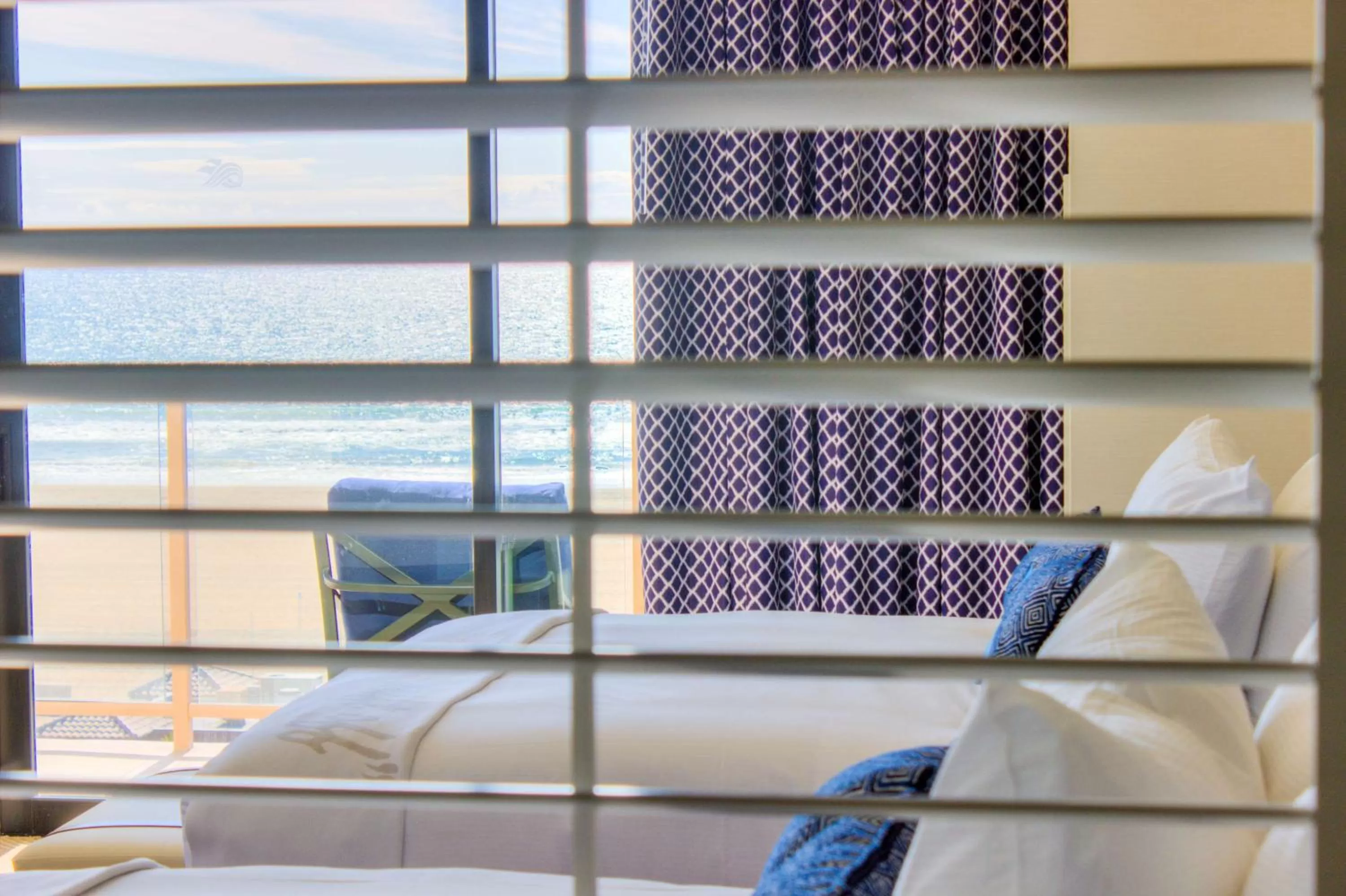 Bed in The Waterfront Beach Resort, A Hilton Hotel