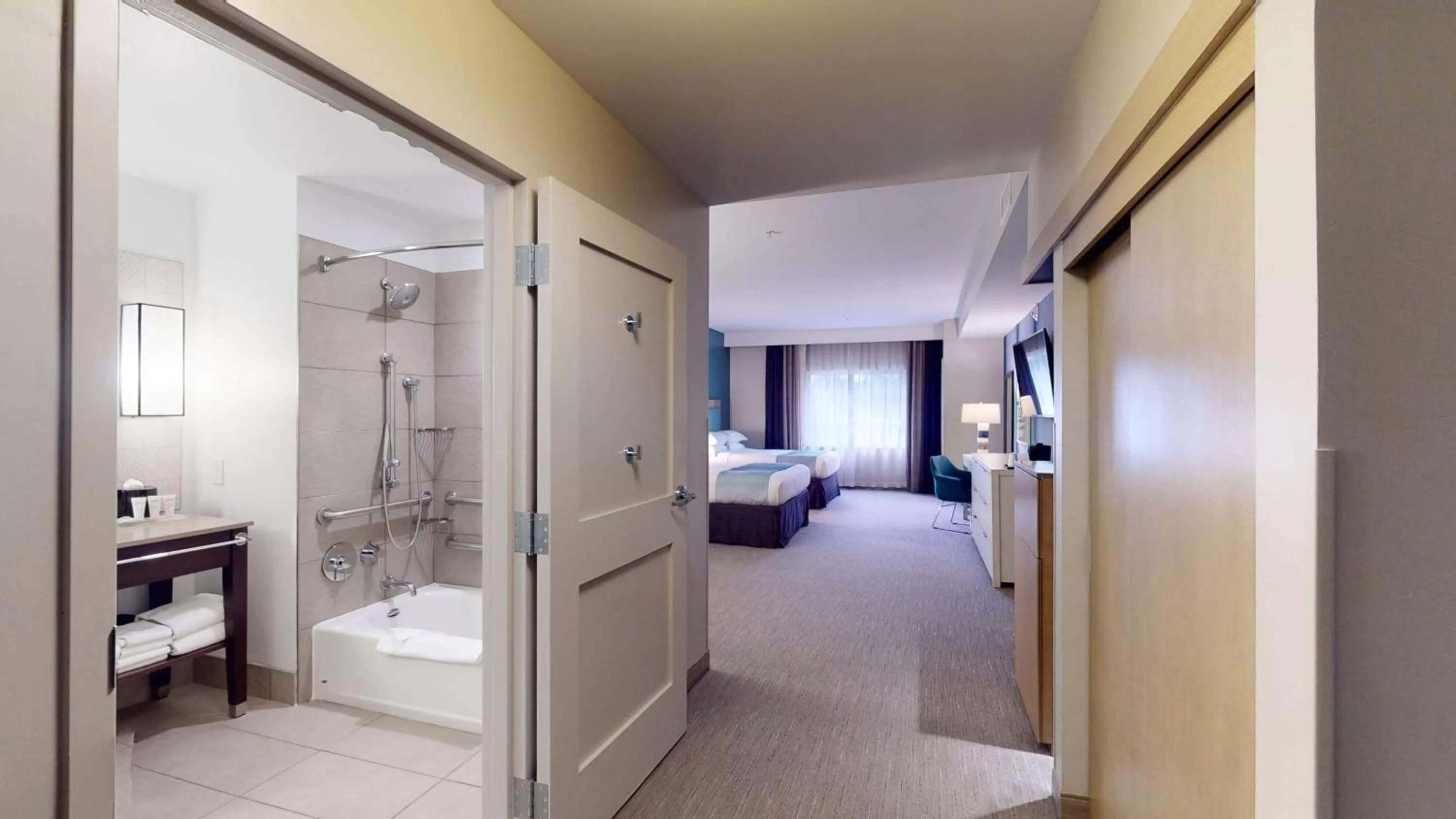 Bathroom, Bed in SunCoast Hotel Anaheim, Tapestry Collection by Hilton