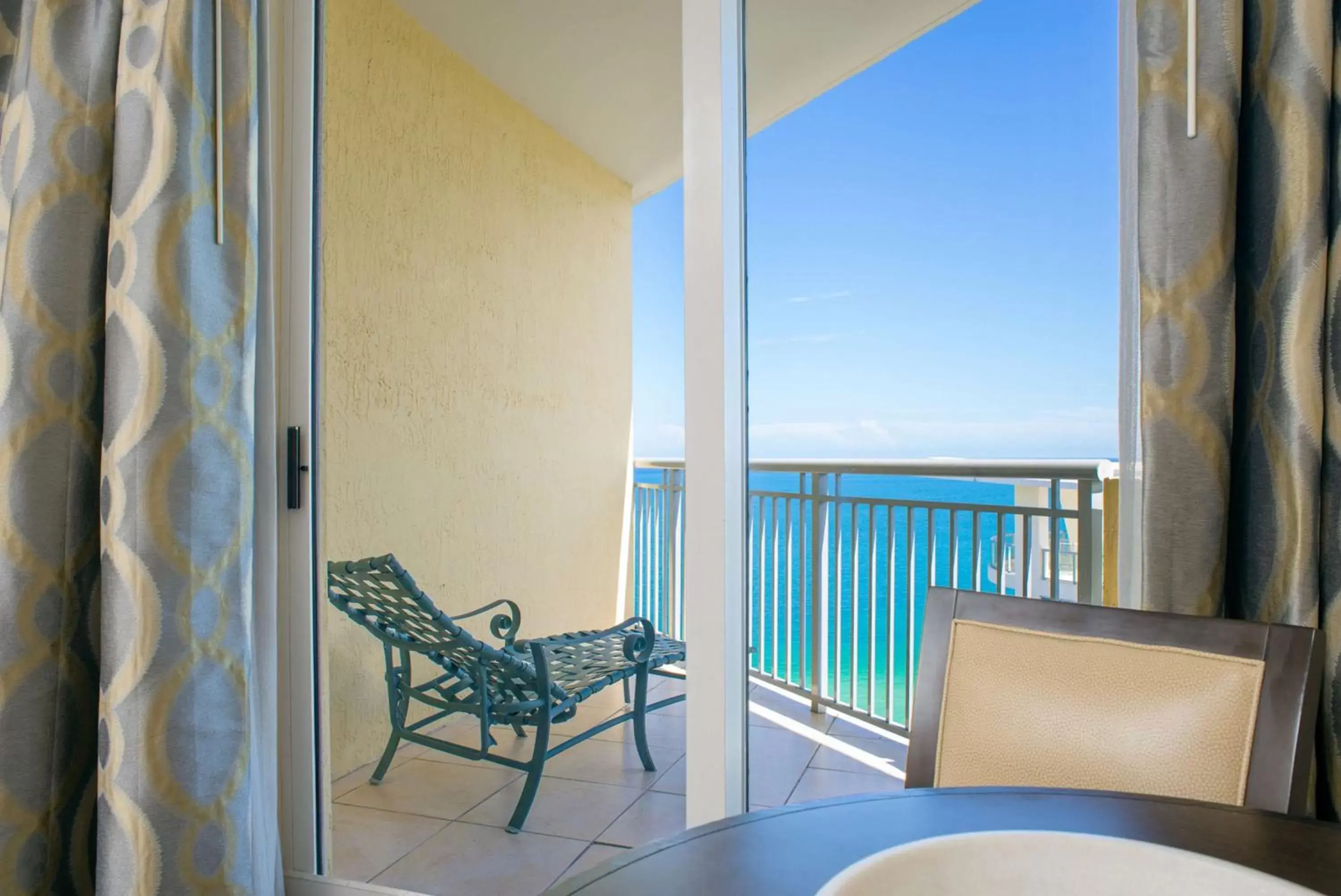 Bed, Balcony/Terrace in DoubleTree by Hilton Ocean Point Resort - North Miami Beach