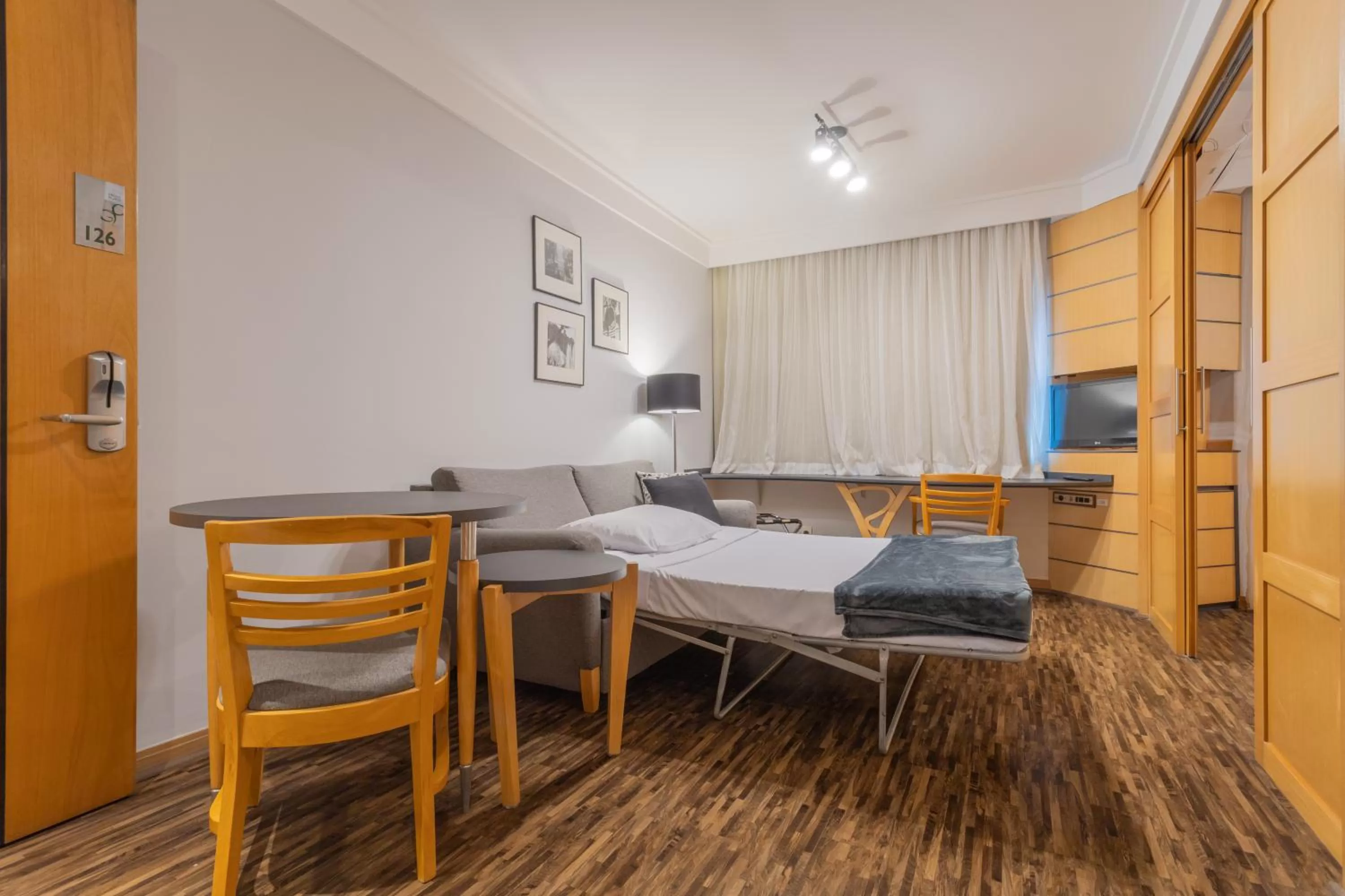 Living room, Bed in Green Place Ibirapuera