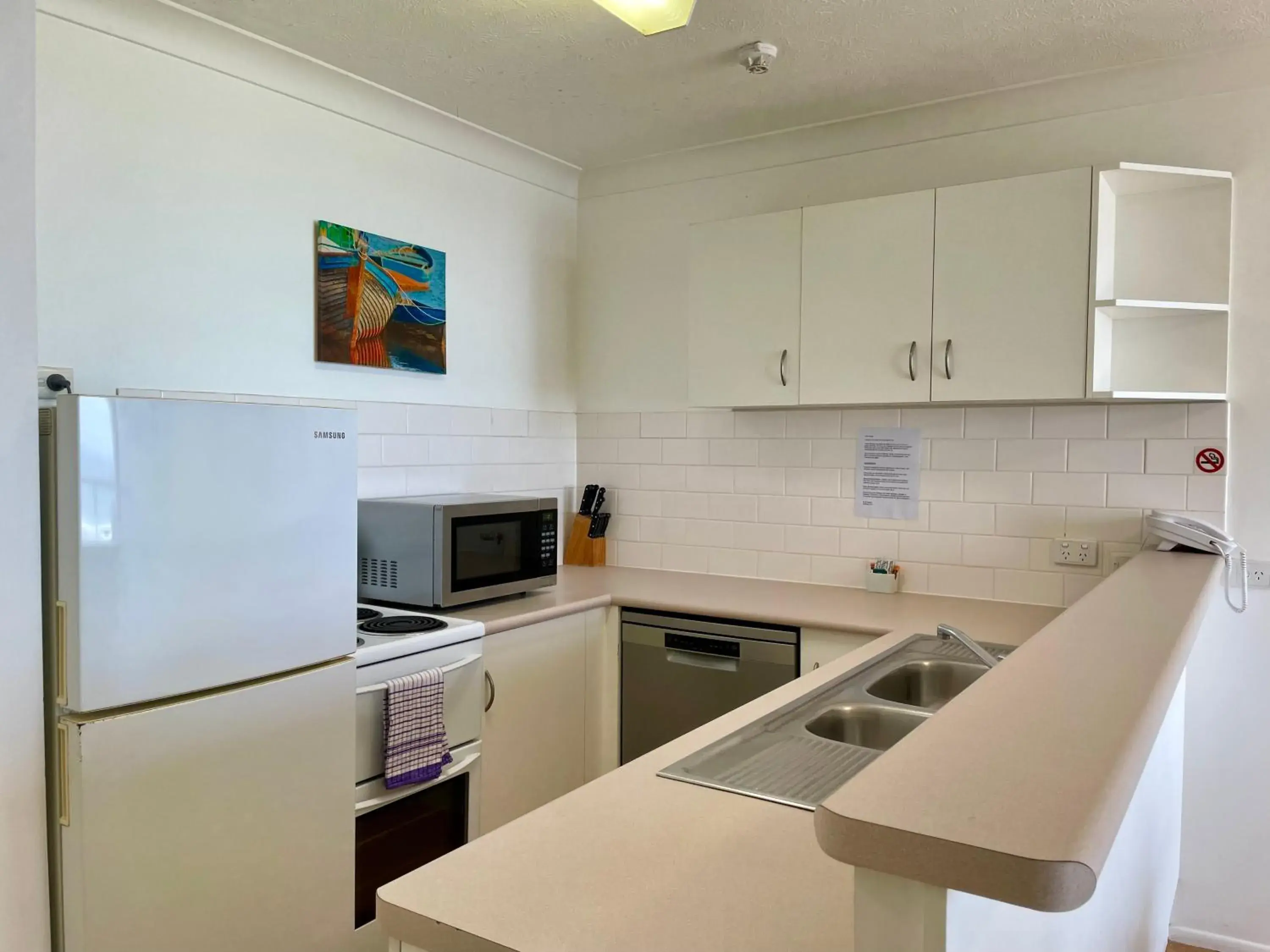 Kitchen/Kitchenette in Warringa Surf Holiday Apartments